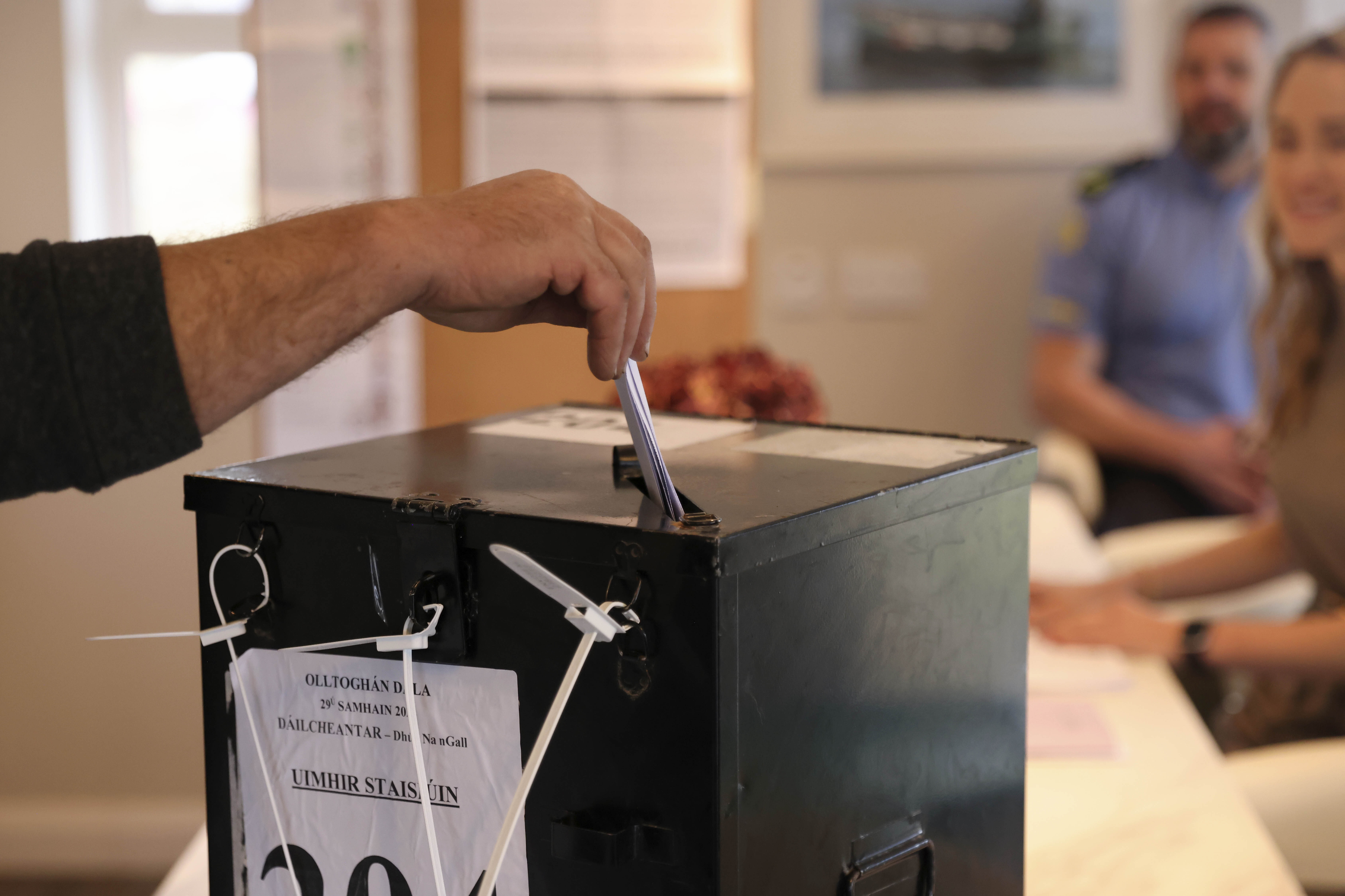 A man casts his vote in a ballot box on the Island of Gola as voters go to polls the for the 2024 General Election in Ireland, Friday, Nov. 29, 2024. (AP Photo/Peter Morrison)