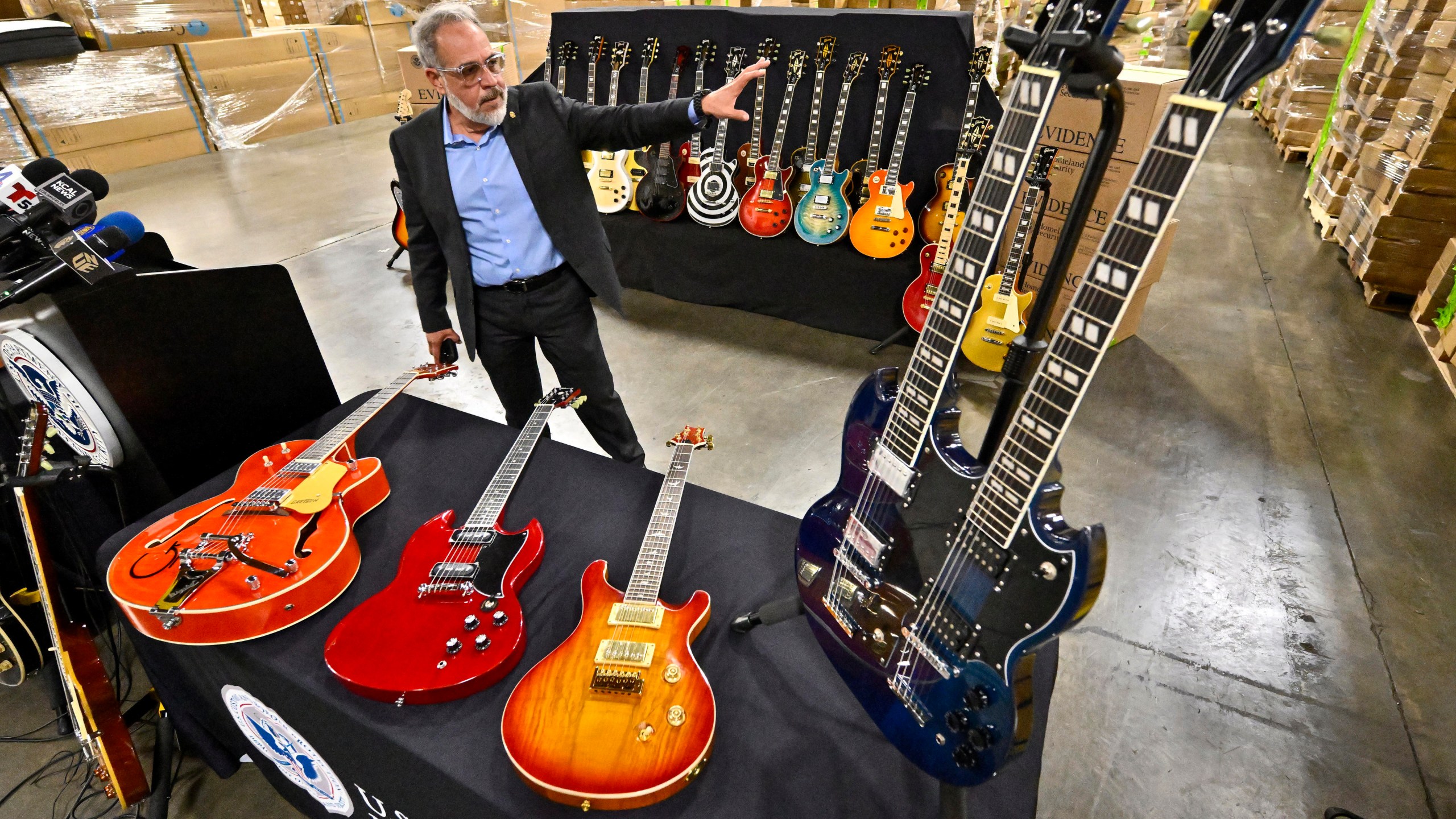 Jaime Ruiz, spokesman for the U.S. Customs and Border Protection, shows off fake guitars during a U.S. Customs and Border Protection media conference in Carson, Calif., on Tuesday, Nov. 26, 2024. (Jeff Gritchen/The Orange County Register via AP)