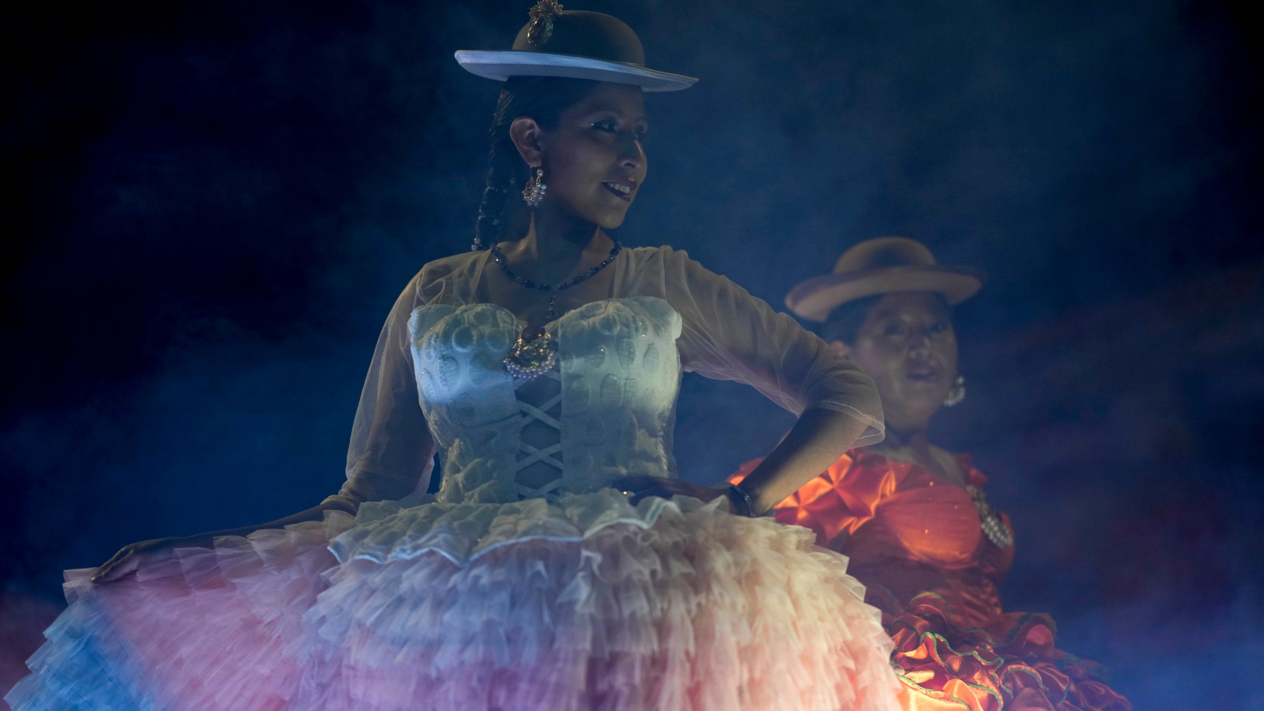 Women model creations by a local designer at a Chola fashion show, promoting the Andean style and beauty of Aymara women, in Viacha, Bolivia, Friday, Nov. 29, 2024. (AP Photo/Juan Karita)