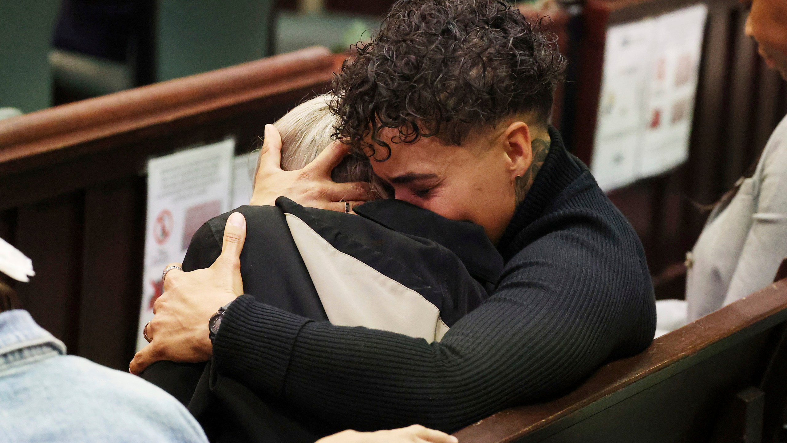 Family members of Jorge Torres, Jr. react at the sentencing of Sarah Boone in a courtroom of the Orange County Courthouse in Orlando, Florida, on Monday, Dec. 2, 2024. (Stephen M. Dowell/Orlando Sentinel via AP)