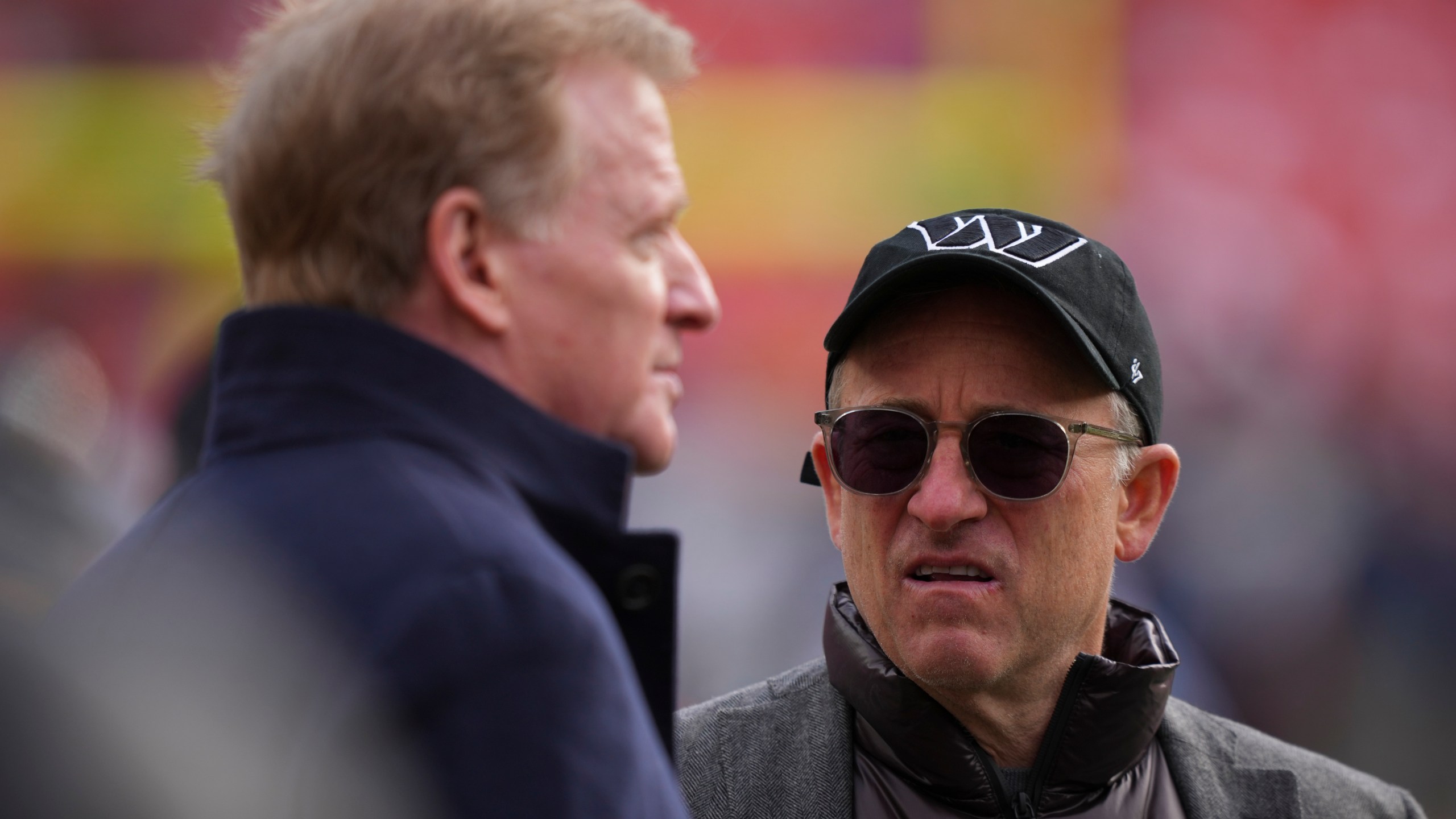 FILE - Washington Commanders managing partner Josh Harris, right, speaks with league commissioner Roger Goodell before an NFL football game against the Tennessee Titans, Sunday, Dec. 1, 2024, in Landover, Md. (AP Photo/Matt Slocum, File)