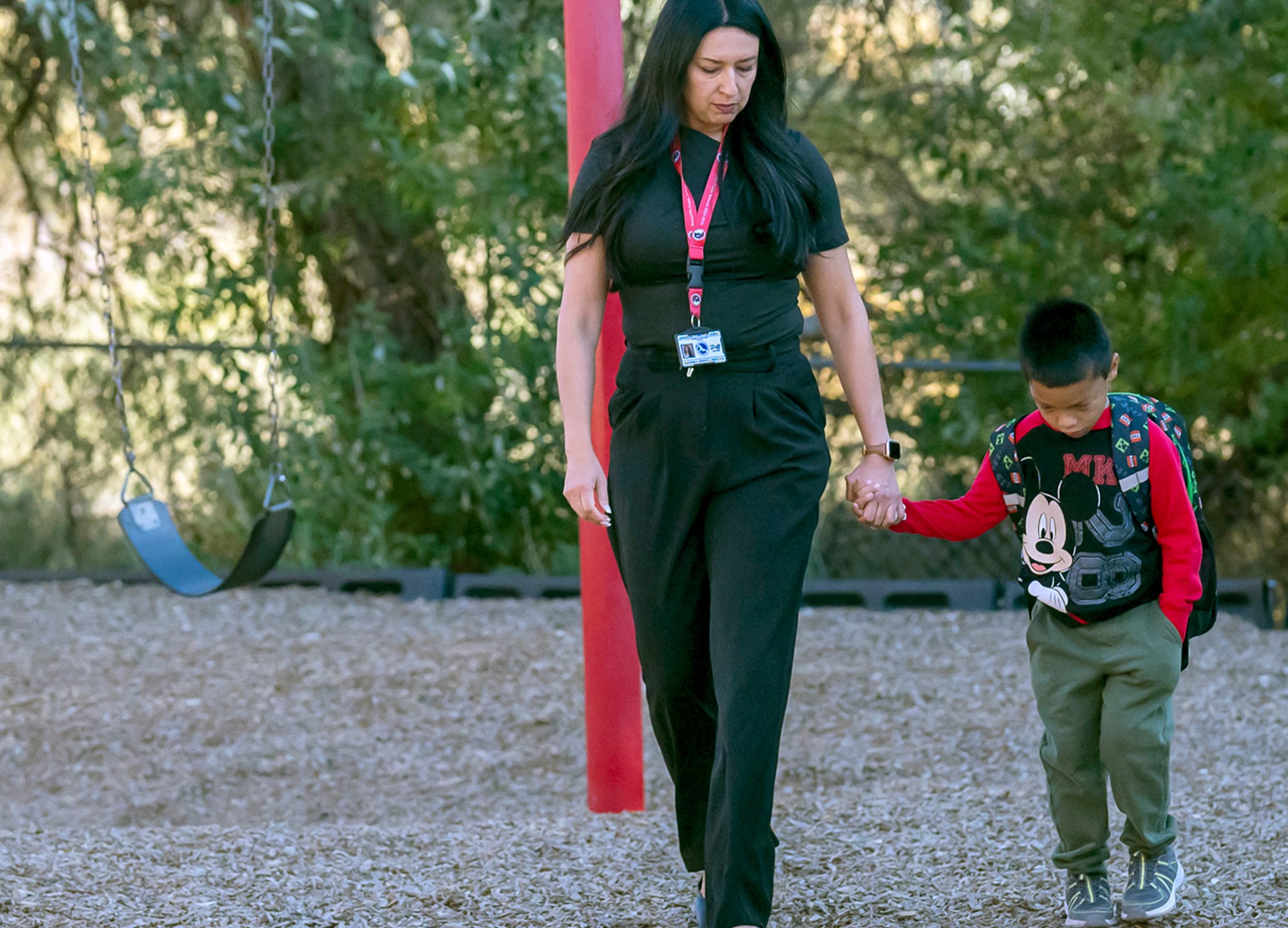 Principal Rosangela Montoya walks Jahim Chavez, 7, back into the school from the playground, Tuesday, Oct. 1, 2024, at Algodones Elementary School in Algodones, N.M. (AP Photo/Roberto E. Rosales)