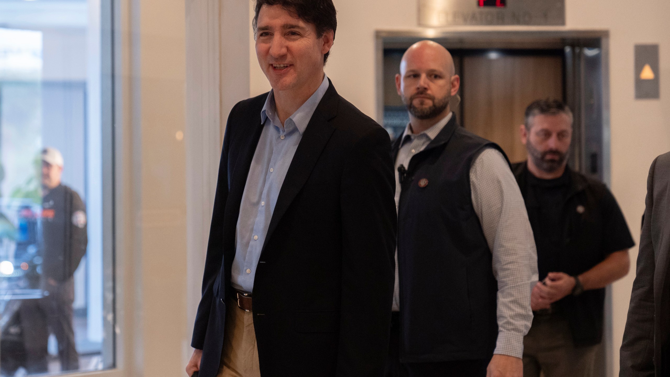 Canada Prime Minister Justin Trudeau walks through the lobby of the Delta Hotel by Marriott, Saturday, Nov. 30, 2024, in West Palm Beach, Fla. (AP Photo/Carolyn Kaster)