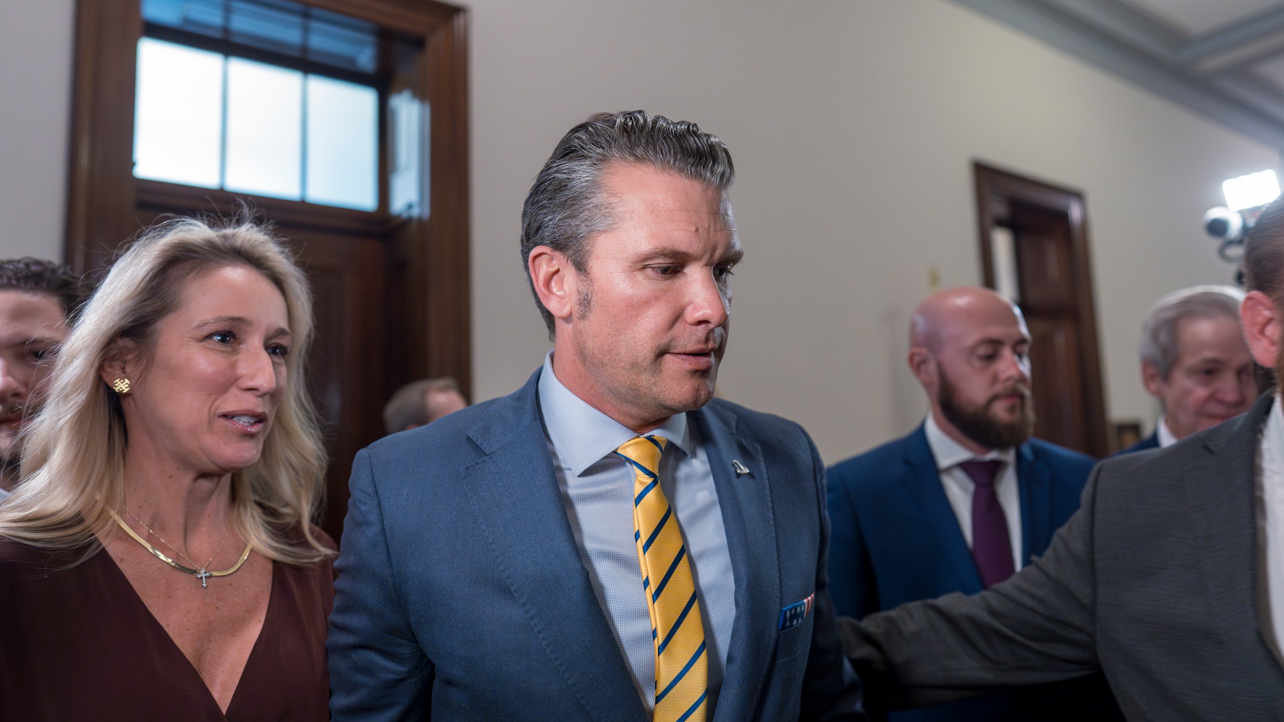 Pete Hegseth, President-elect Donald Trump's nominee to be defense secretary, is joined by his wife Jennifer Rauchet, left, as they arrive to meet with Sen. Ted Budd, R-N.C., a member of the Senate Armed Services Committee, at the Capitol in Washington, Tuesday, Dec. 3, 2024. (AP Photo/J. Scott Applewhite)