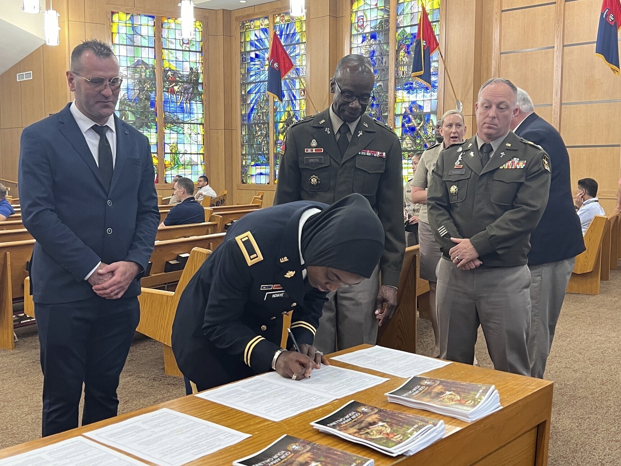 The U.S. Army Chief of Chaplains, Maj. Gen. Bill Green, commissioned the first female Muslim Chaplain Candidate in the Army, Second Lt. Khady Ndiaye during a three-day Army Chaplain Experience event at the All American Chapel, Fort Liberty, N.C., June 5, 2024. (Jason Ragucci, U.S. Army, Fort Liberty Garrion Public Affairs Office via AP)