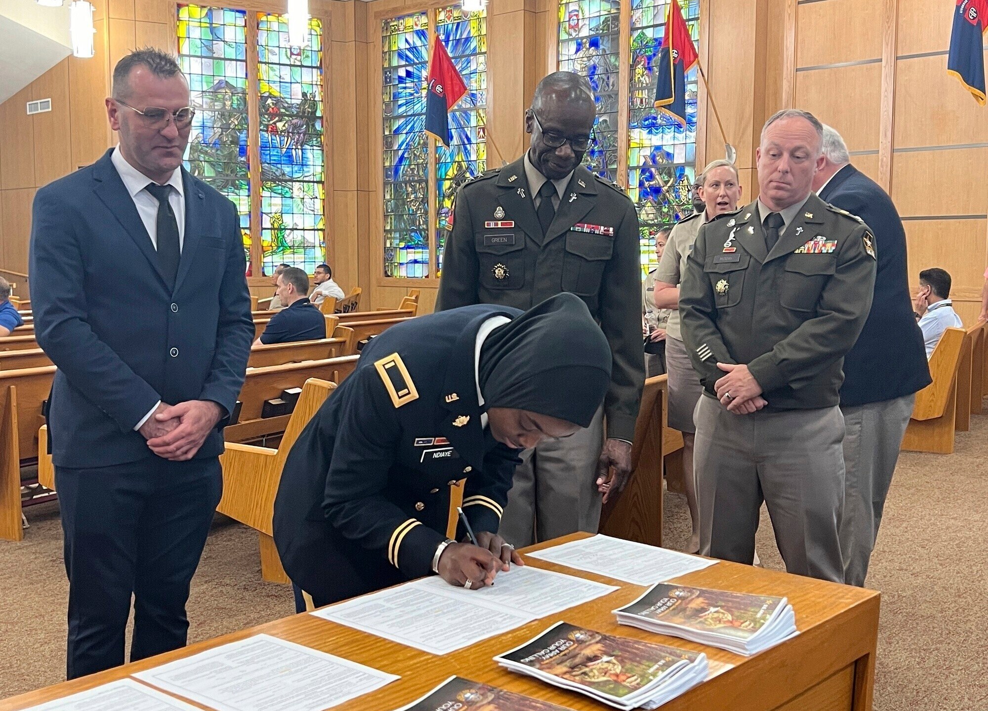 The U.S. Army Chief of Chaplains, Maj. Gen. Bill Green, commissioned the first female Muslim Chaplain Candidate in the Army, Second Lt. Khady Ndiaye during a three-day Army Chaplain Experience event at the All American Chapel, Fort Liberty, N.C., June 5, 2024. (Jason Ragucci, U.S. Army, Fort Liberty Garrion Public Affairs Office via AP)