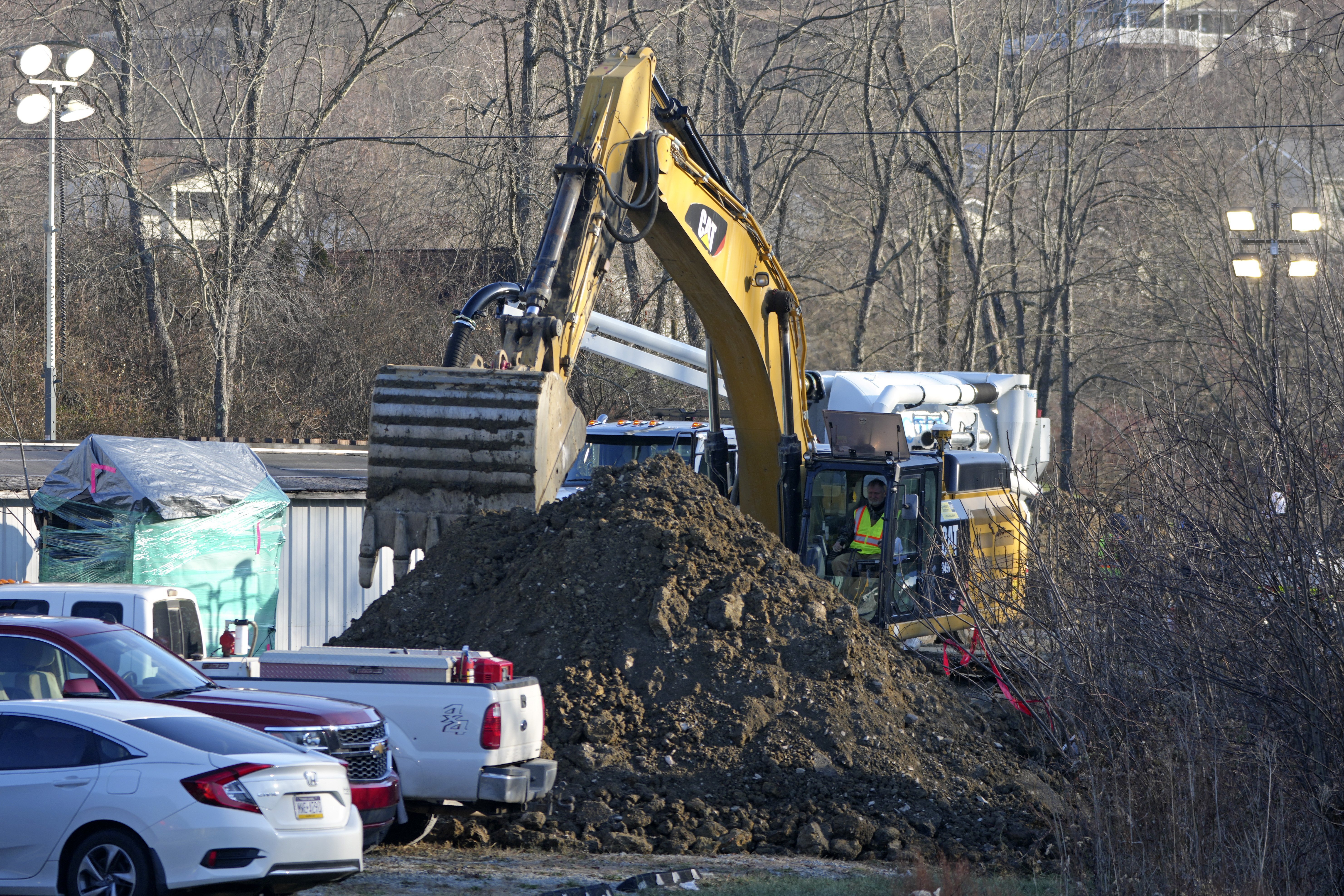 Rescue workers continue to search, Wednesday, Dec. 4, 2024, for Elizabeth Pollard, who is believed to have disappeared in a sinkhole while looking for her cat, in Marguerite, Pa. (AP Photo/Gene J. Puskar)