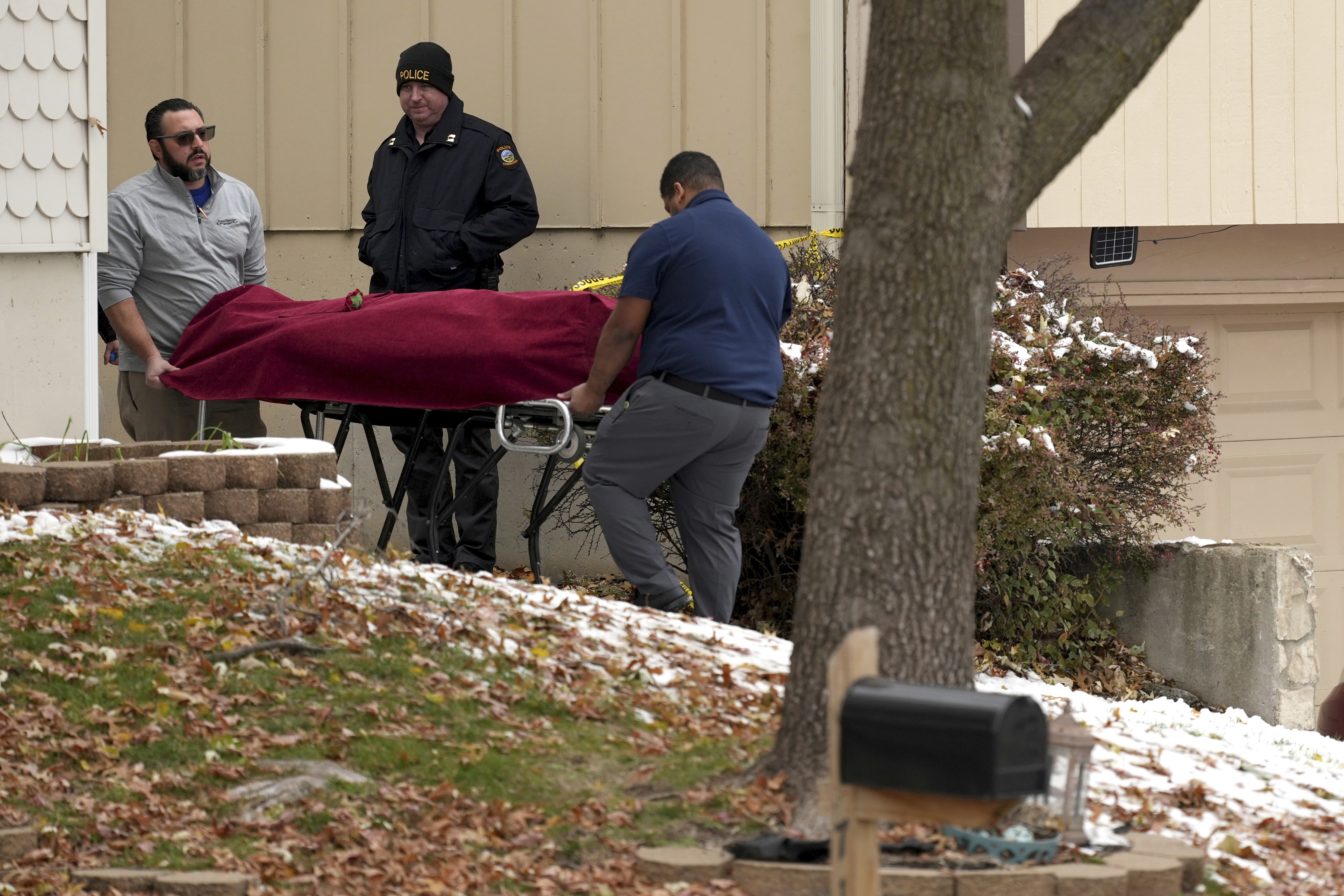 Workers carry a body from the home of former Kansas City, Kan. police detective Roger Golubski on Monday, Dec. 2, 2024, in Edwardsville, Kan. (AP Photo/Charlie Riedel)