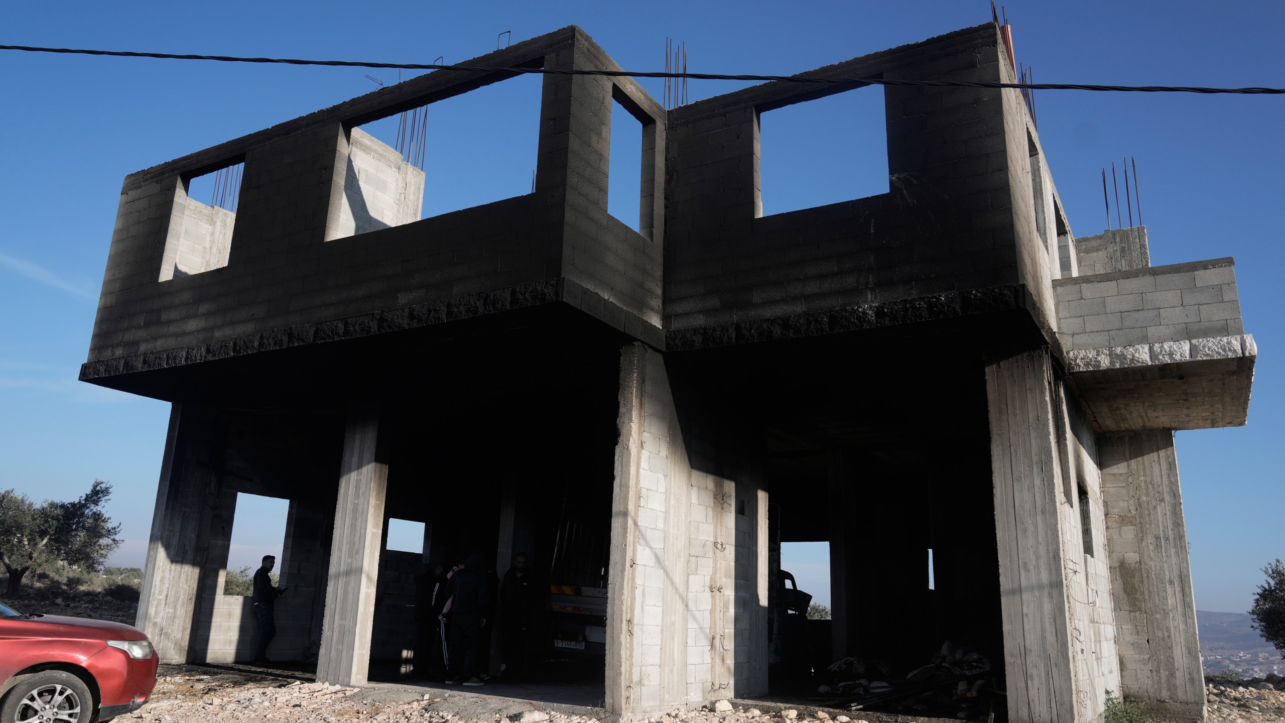 A burnt house following a settler attack that damaged vehicles and houses in the village of Beit Furik, in the occupied West Bank city of Nablus, Wednesday, Dec. 4, 2024. (AP Photo/Majdi Mohammed)