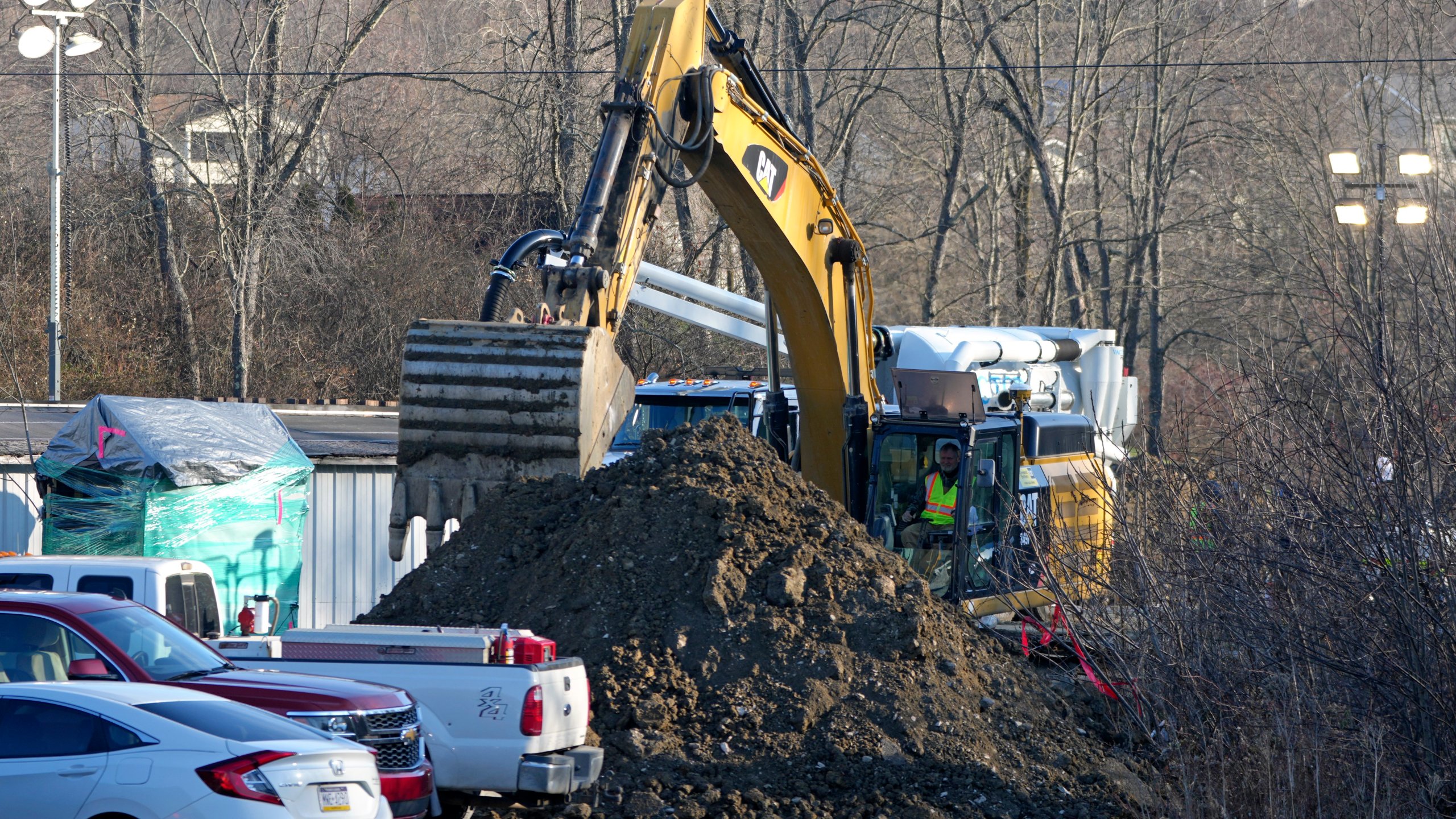 Rescue workers continue to search, Wednesday, Dec. 4, 2024, for Elizabeth Pollard, who is believed to have disappeared in a sinkhole while looking for her cat, in Marguerite, Pa. (AP Photo/Gene J. Puskar)