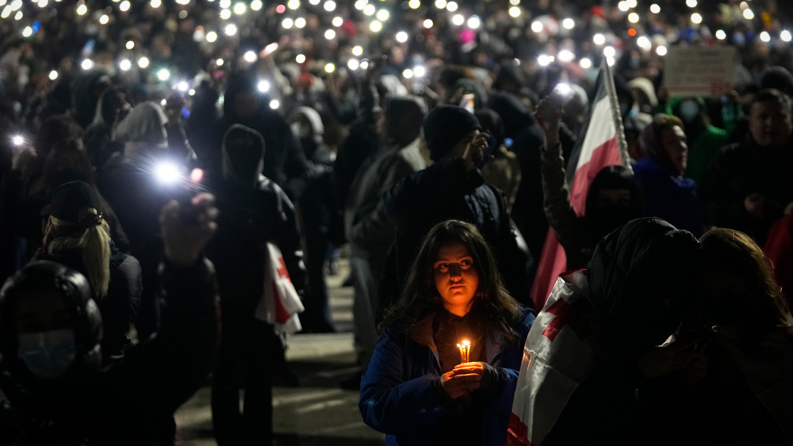 Demonstrators gather to protest against the government's decision to suspend negotiations on joining the European Union, in Tbilisi, Georgia, on Wednesday, Dec. 4, 2024. (AP Photo/Pavel Bednyakov)