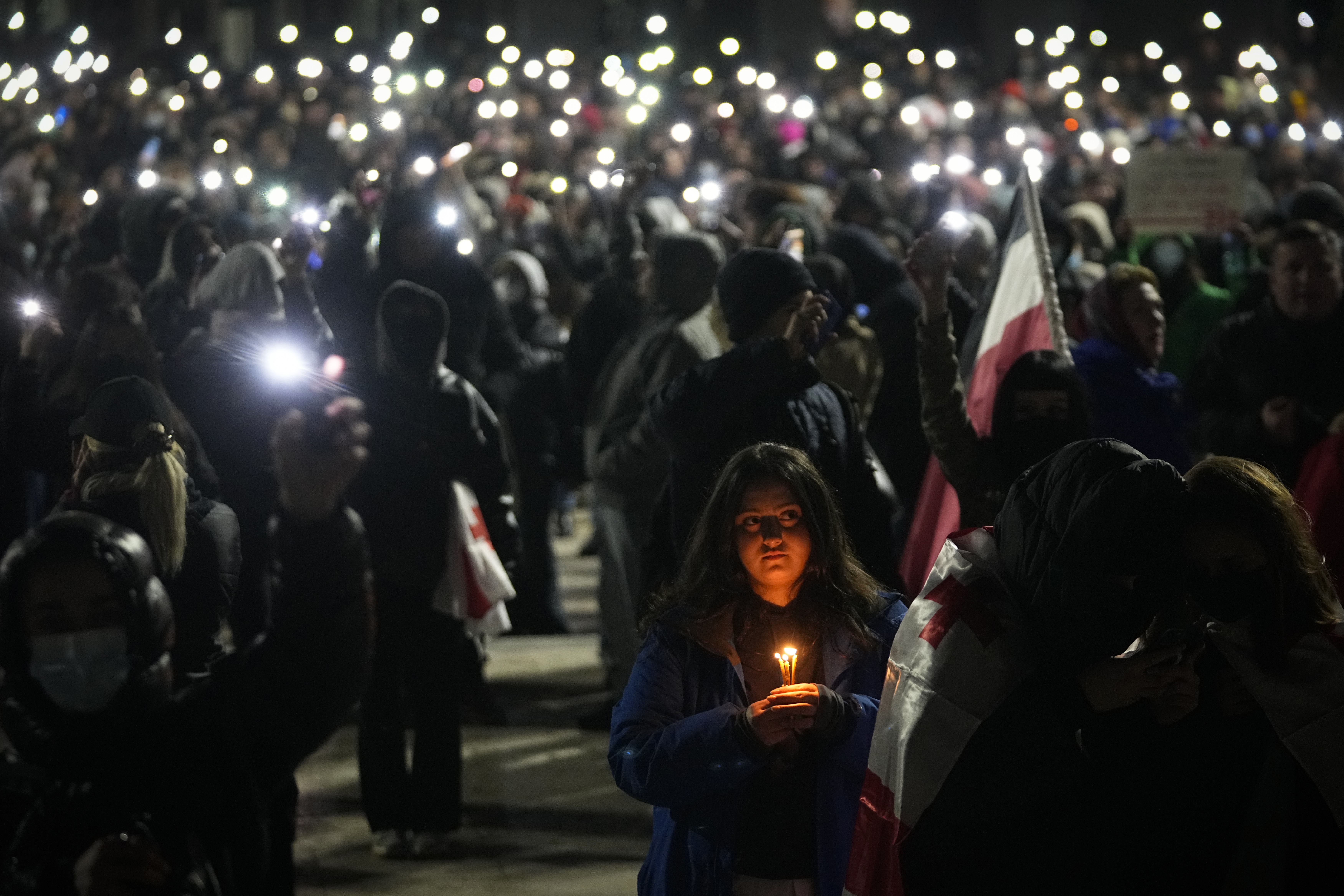 Demonstrators gather to protest against the government's decision to suspend negotiations on joining the European Union, in Tbilisi, Georgia, on Wednesday, Dec. 4, 2024. (AP Photo/Pavel Bednyakov)