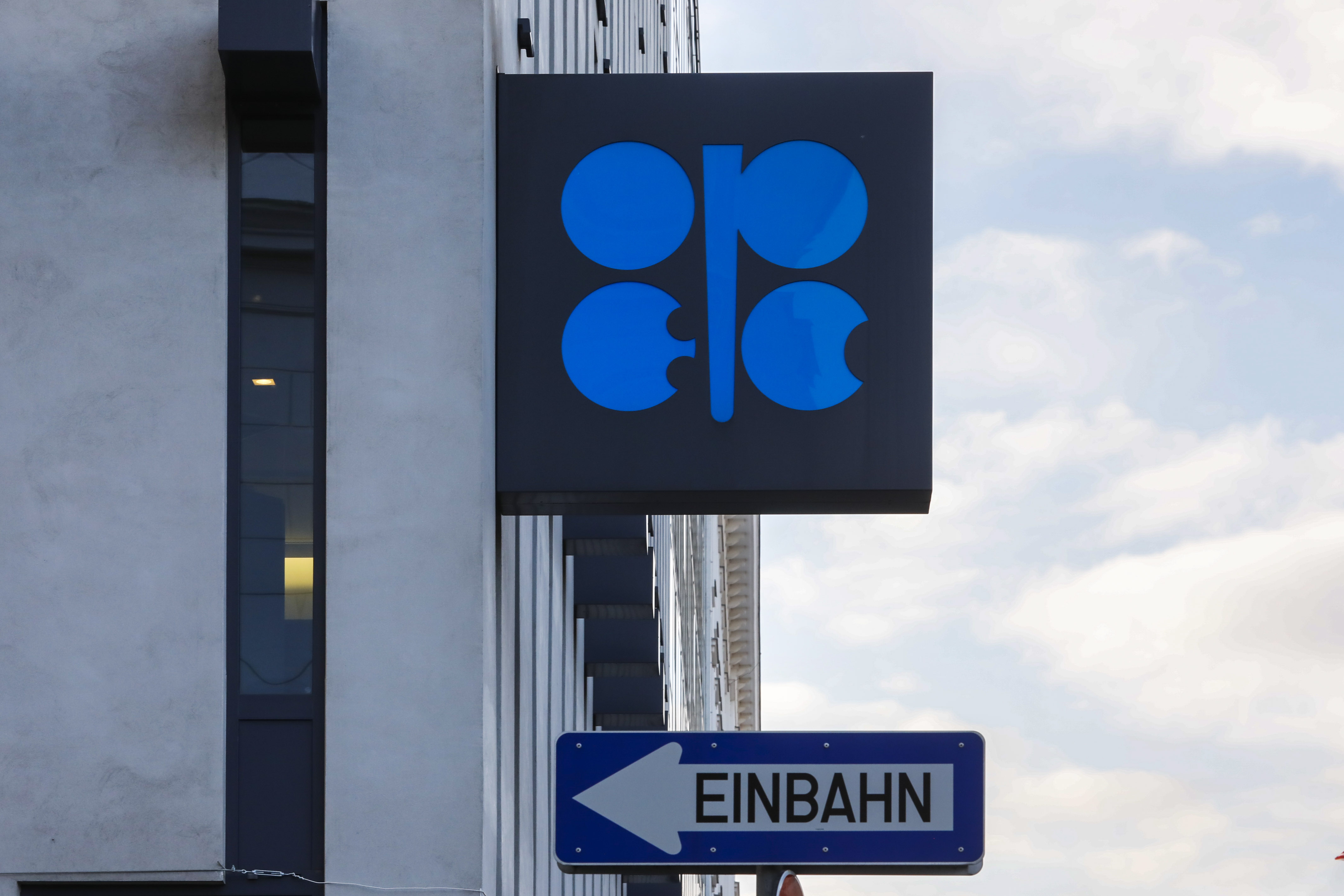 FILE -The logo of the Organization of the Petroleoum Exporting Countries (OPEC) is seen outside of OPEC's headquarters in Vienna, Austria, March 3, 2022. A street sign that says „one way" is positioned below the logo. (AP Photo/Lisa Leutner, File)