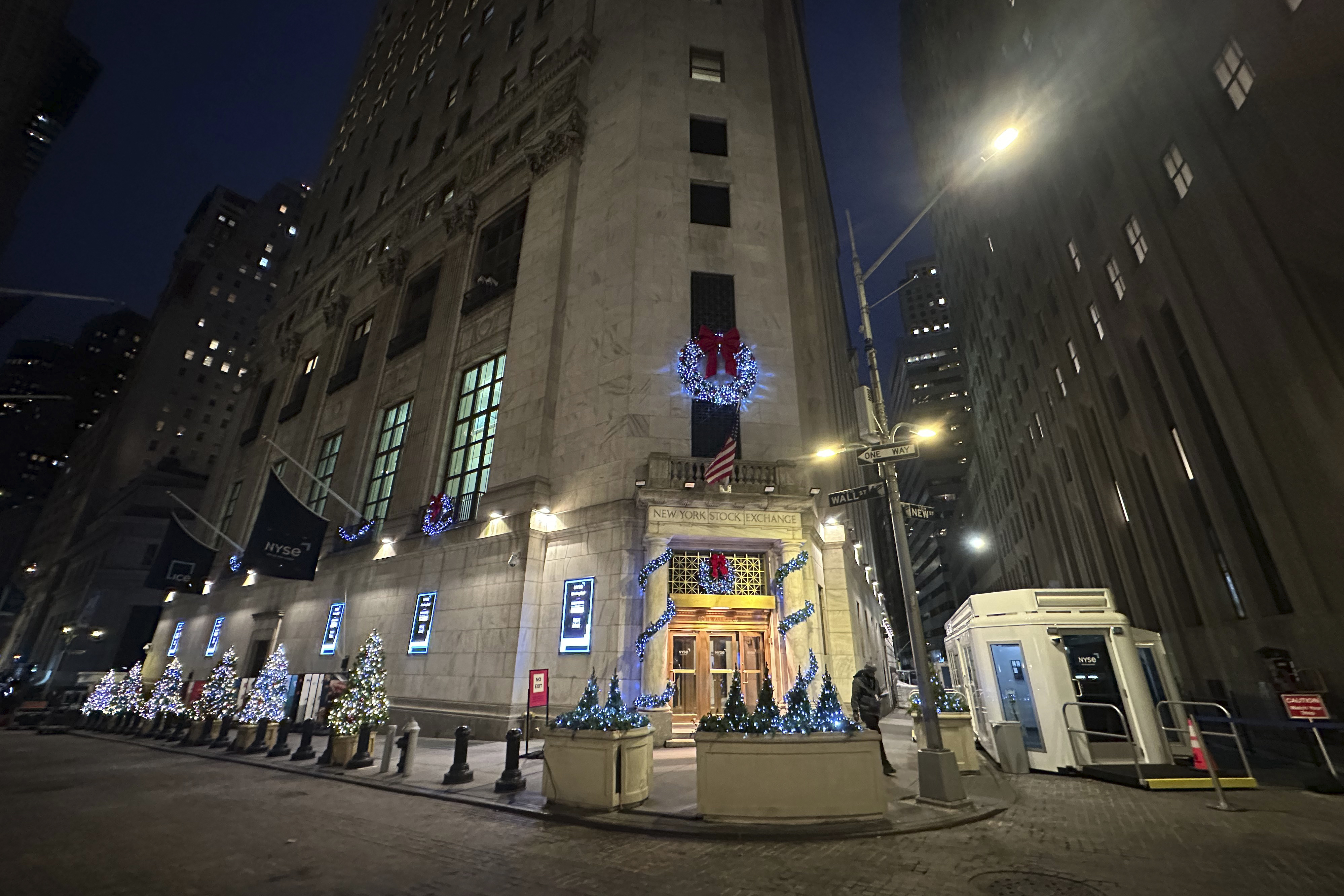 Holiday ornaments adorn the Wall Street side of the New York Stock Exchange in New York's Financial District on Wednesday, Dec. 4, 2024. (AP Photo/Peter Morgan)