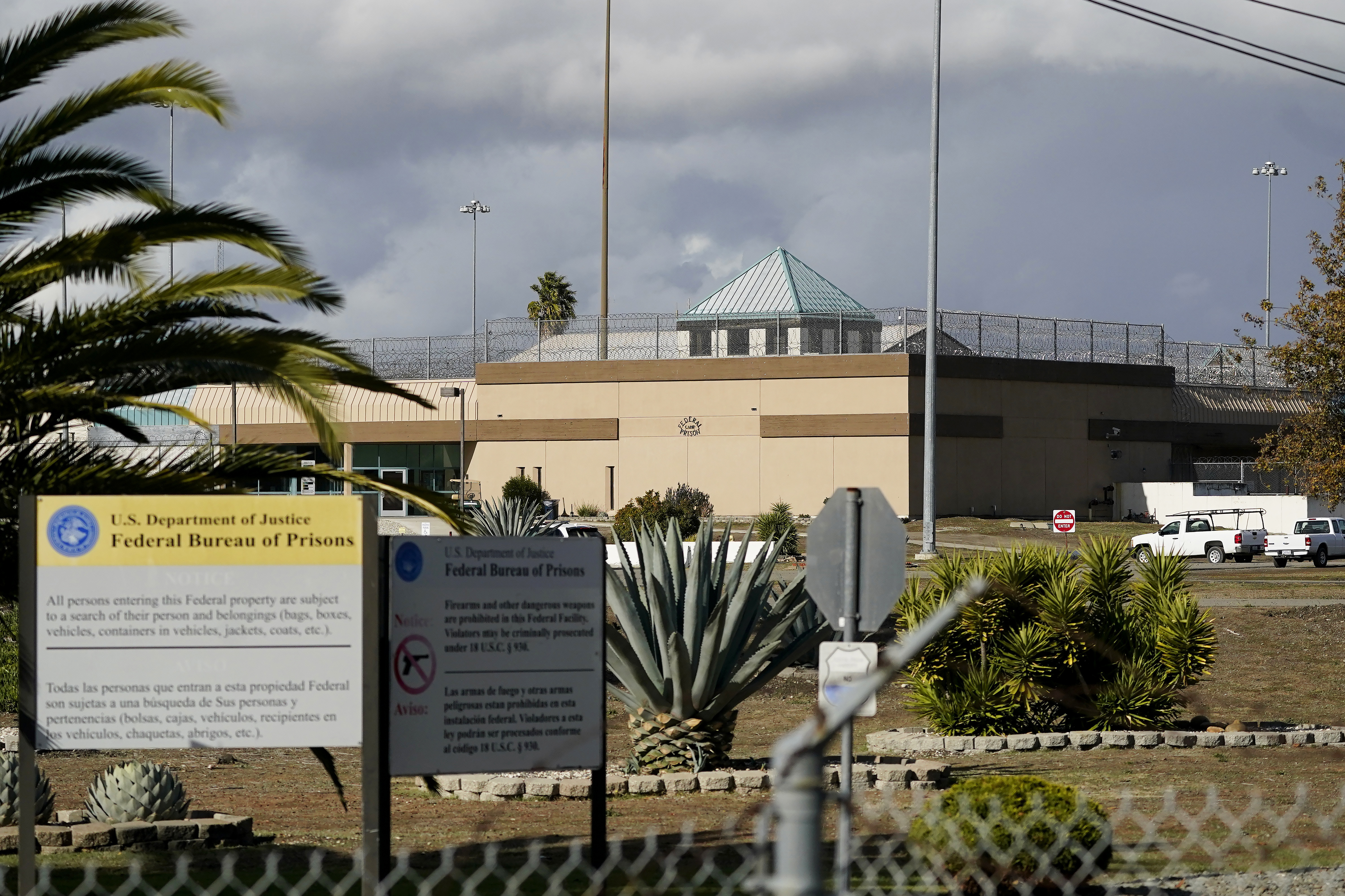 FILE - The Federal Correctional Institution stands in Dublin, Calif., Dec. 5, 2022. The federal Bureau of Prisons is permanently closing its “rape club” women’s prison in California and will idle six other facilities in a sweeping realignment after years of abuse, decay and mismanagement, the Associated Press has learned. (AP Photo/Jeff Chiu, File)