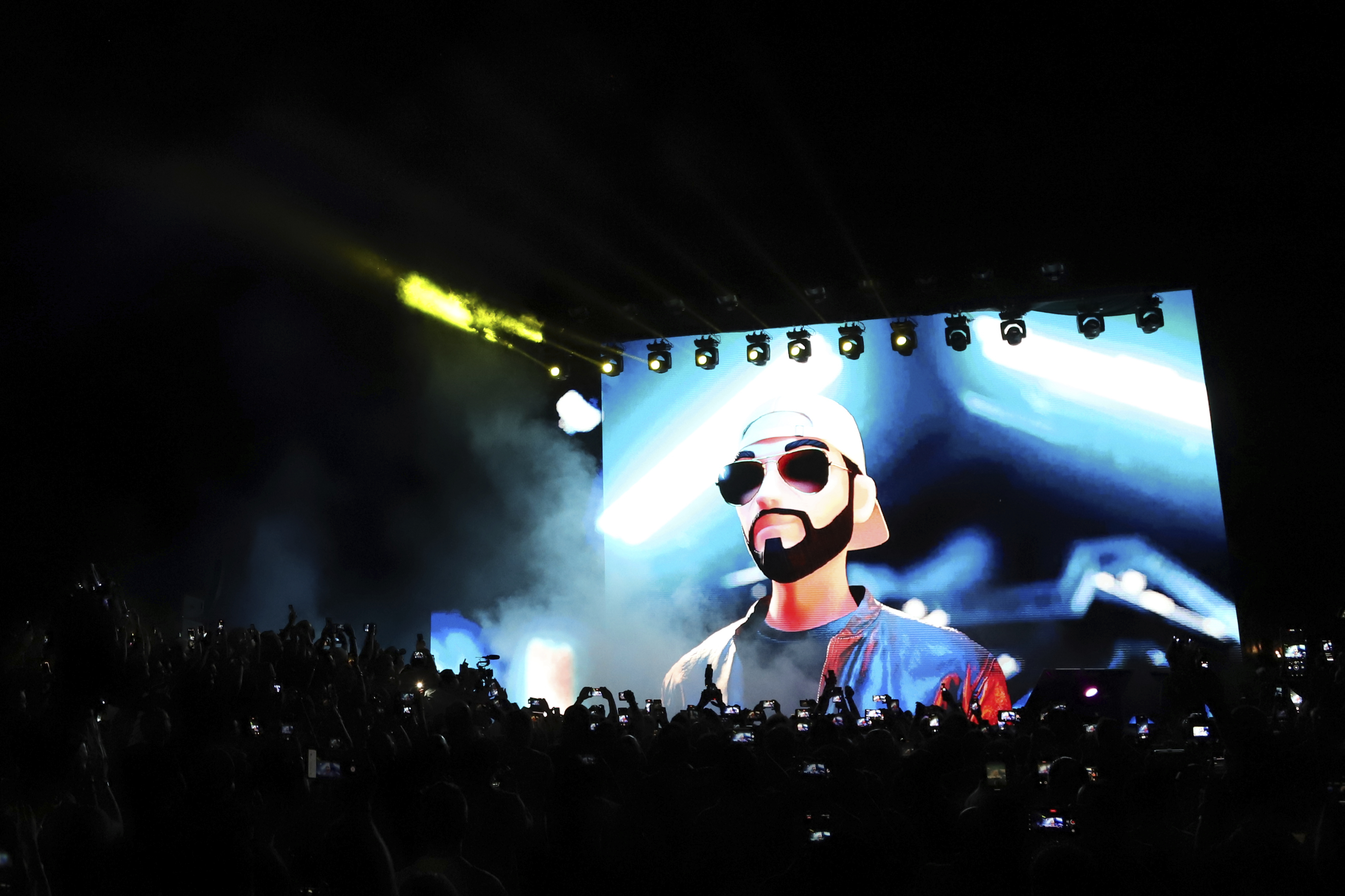 FILE - An avatar of El Salvador's President Nayib Bukele, is projected on a LED screen during the closing ceremony of a congress for cryptocurrency investors in Santa Maria Mizata, El Salvador, Nov. 20, 2021. (AP Photo/Salvador Melendez, File)