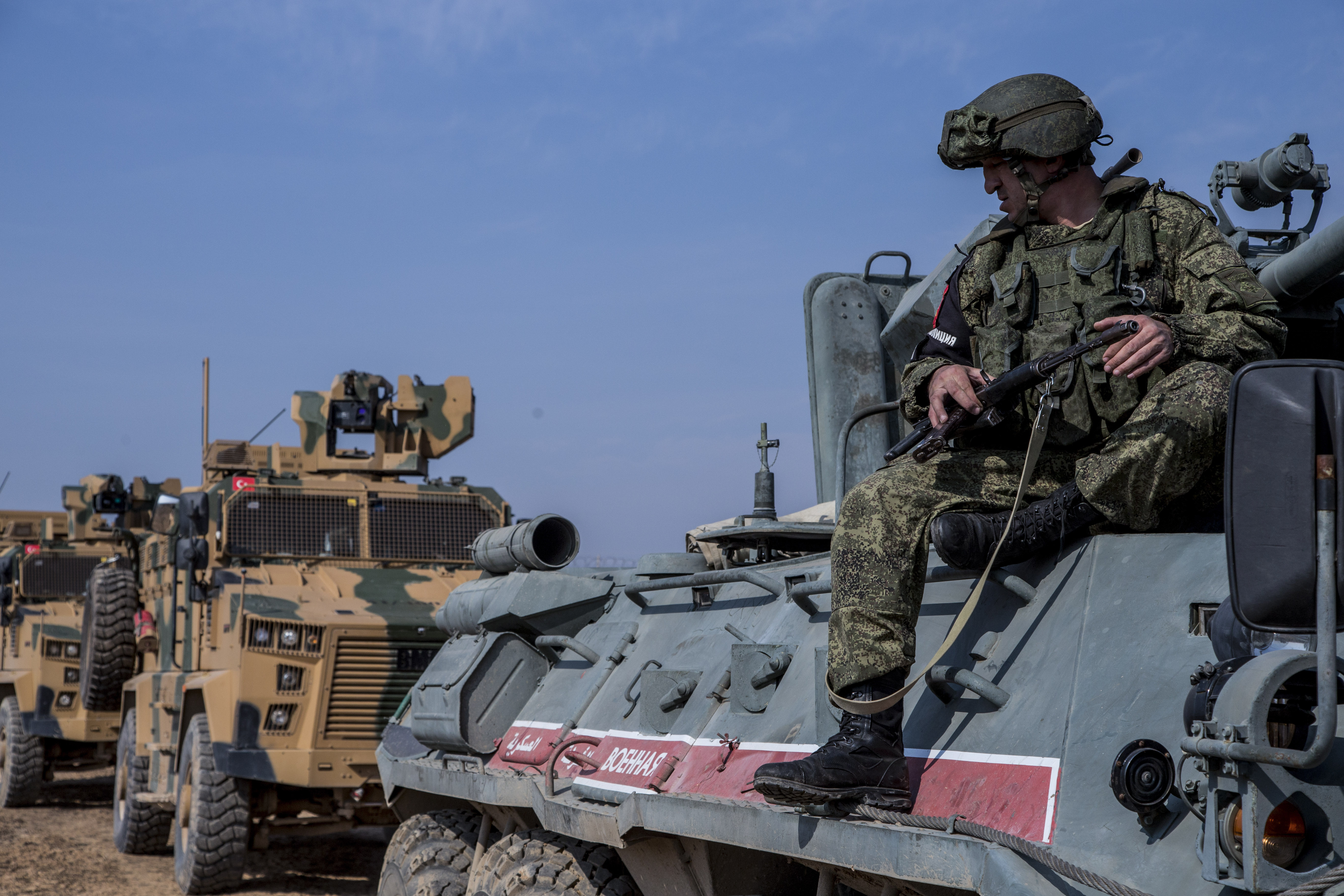 FILE - A Turkish and Russian patrol is seen near the town of Darbasiyah, Syria, Friday, Nov. 1, 2019. (AP Photo/Baderkhan Ahmad, File)