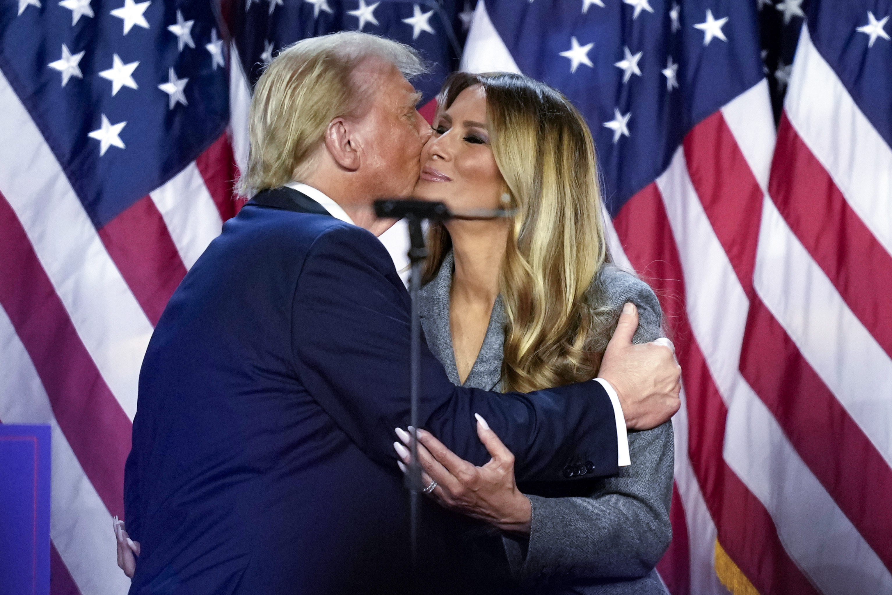 FILE - Republican presidential nominee former President Donald Trump, left, kisses Melania Trump at an election night watch party, Nov. 6, 2024, in West Palm Beach, Fla. (AP Photo/Alex Brandon, File)