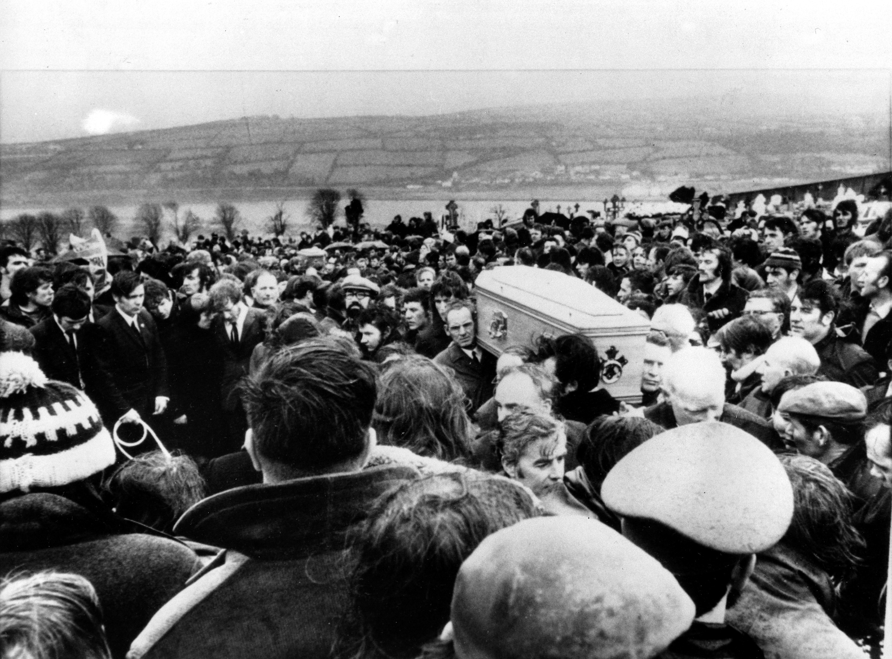 FILE - In this Feb. 2, 1972 file photo, pallbearers carry one of 13 coffins of Bloody Sunday victims to a graveside during a funeral in Londonderry, Northern Ireland, following requiem mass at nearby St. Mary's church at Creggan Hill. (AP Photo/File)