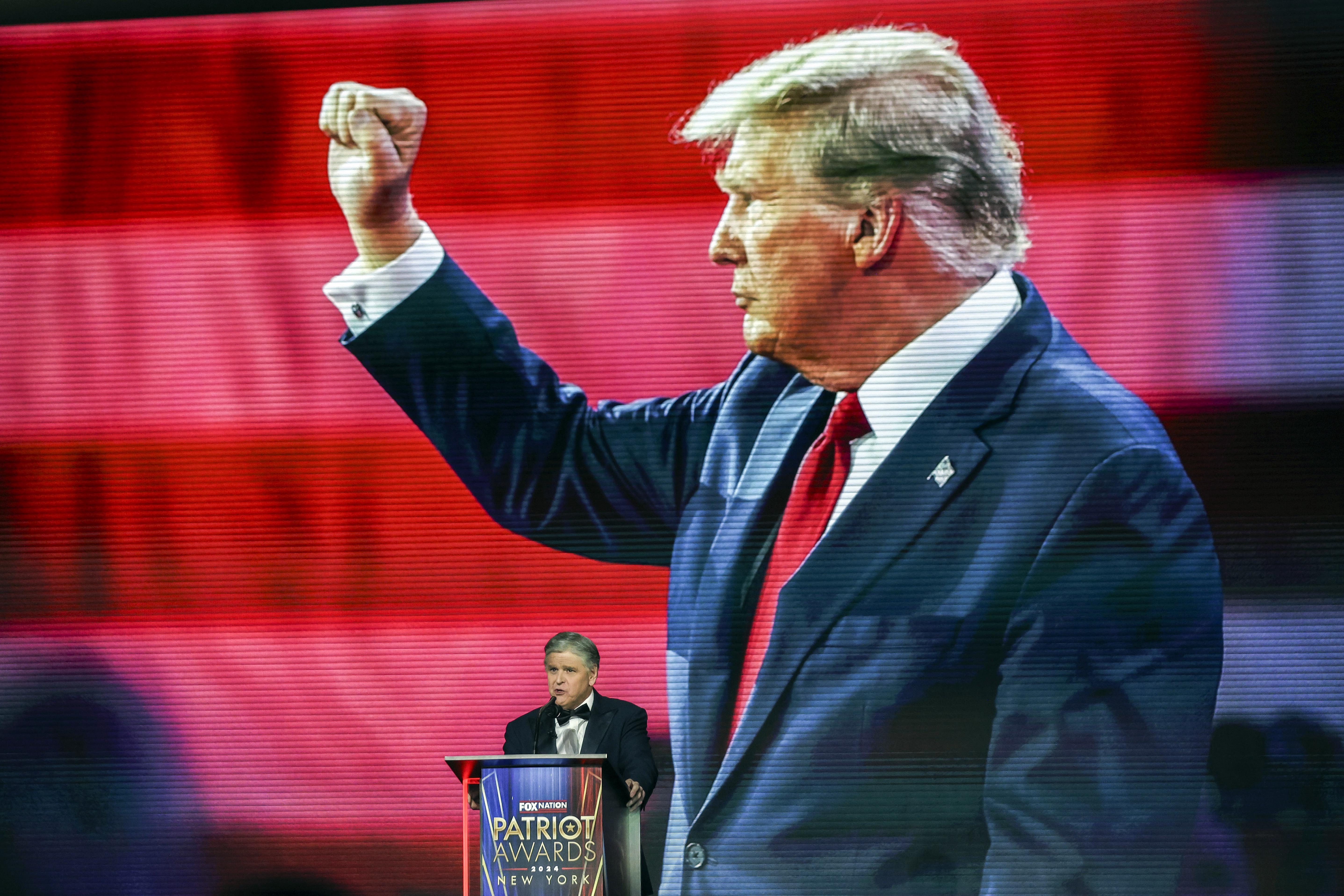 Sean Hannity introduces President-elect Donald Trump before awarding him the 'Patriot of the Year' award at the FOX Nation Patriot Awards, Thursday, Dec. 5, 2024, in Greenvale, N.Y. (AP Photo/Heather Khalifa)