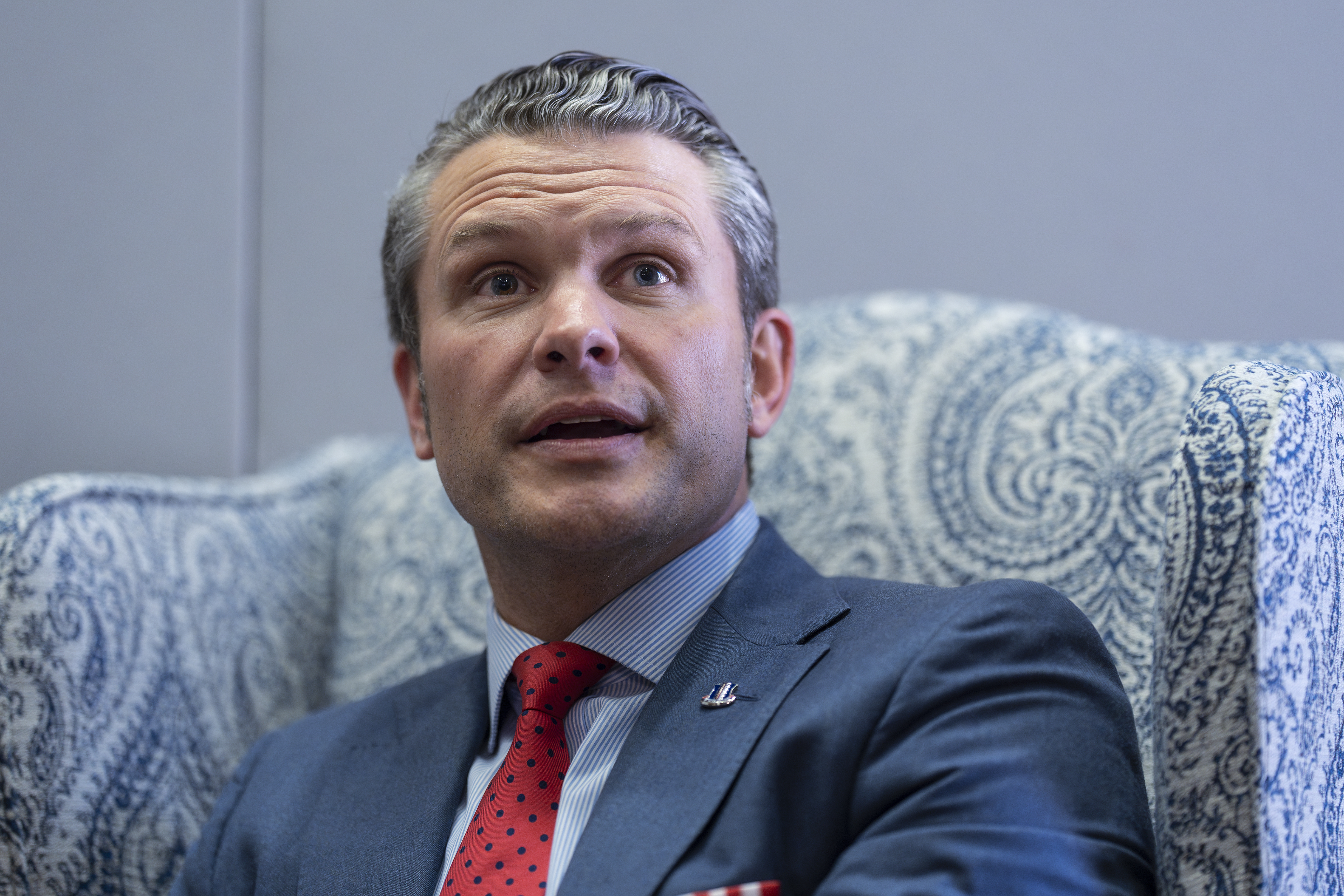 Pete Hegseth, President-elect Donald Trump's nominee to be defense secretary, responds to reporters during a meeting with Sen. Mike Rounds, R-S.D., a member of the Senate Armed Services Committee, at the Capitol in Washington, Thursday, Dec. 5, 2024. (AP Photo/J. Scott Applewhite)