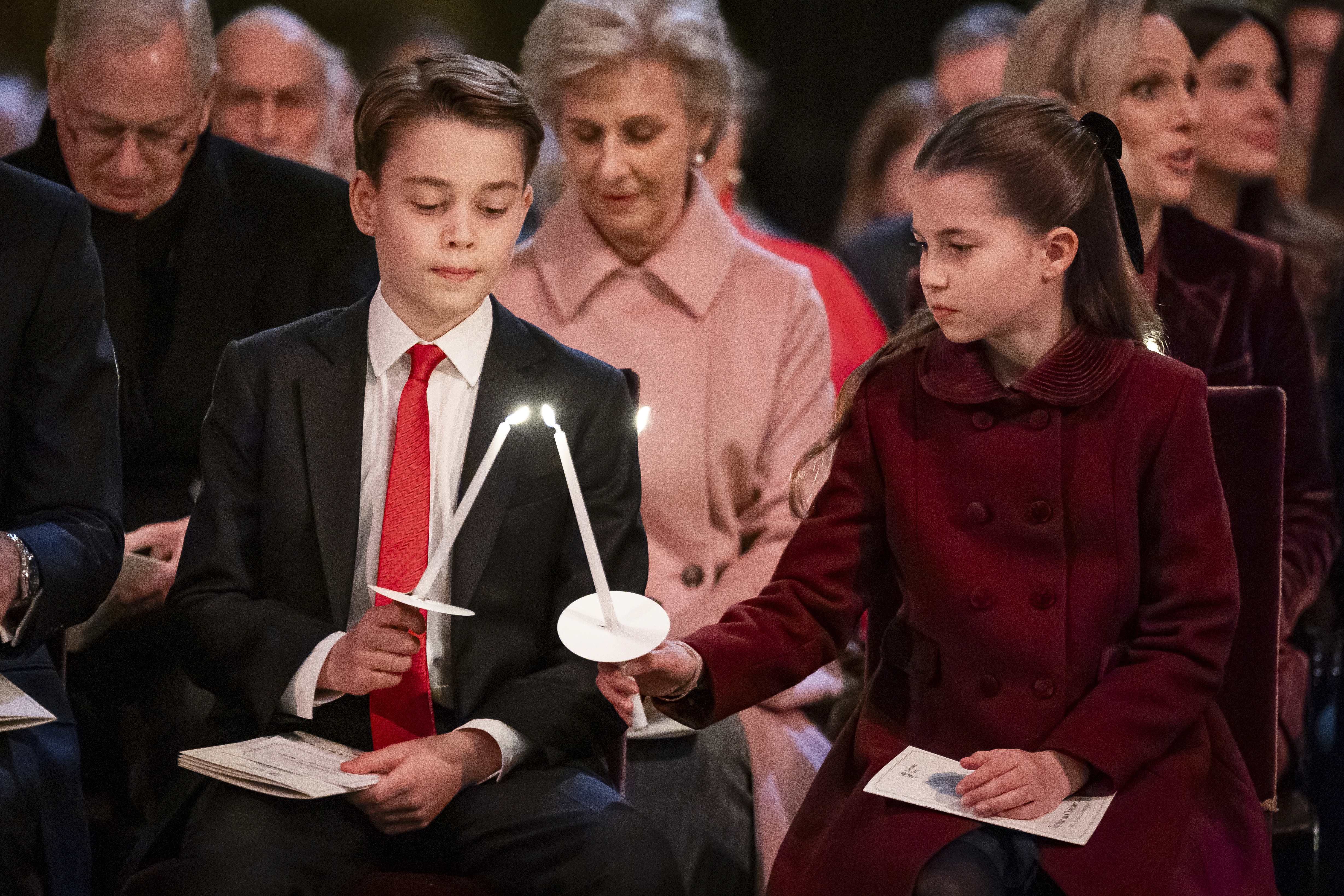 Britain's Prince George and Princess Charlotte during the Together At Christmas carol service at Westminster Abbey, in London, Friday, Dec. 6, 2024. (Aaron Chown/Pool Photo via AP)