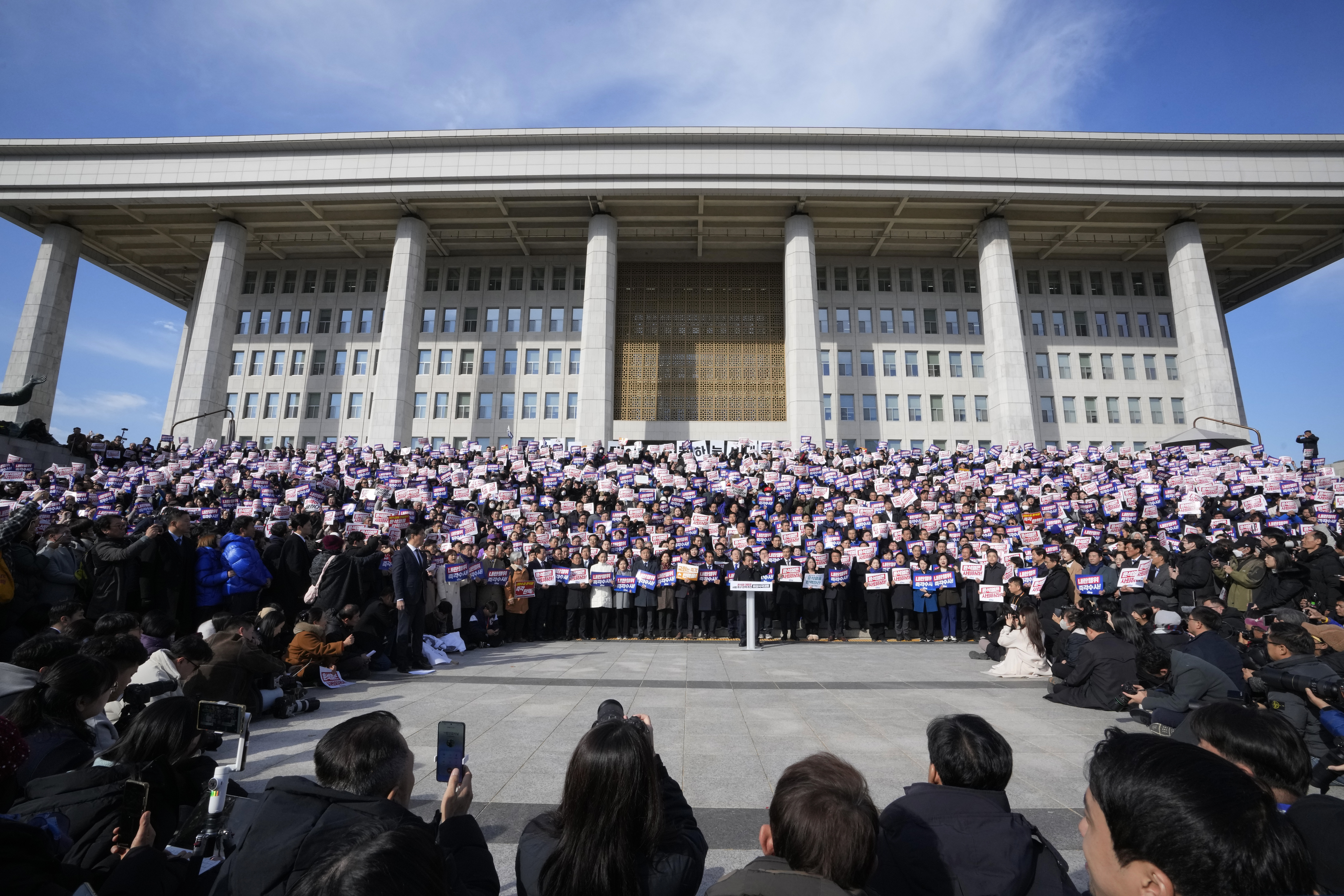 Members of main opposition Democratic Party stage a rally against South Korean President Yoon Suk Yeol at the National Assembly in Seoul, South Korea, Wednesday, Dec. 4, 2024. (AP Photo/Ahn Young-joon)