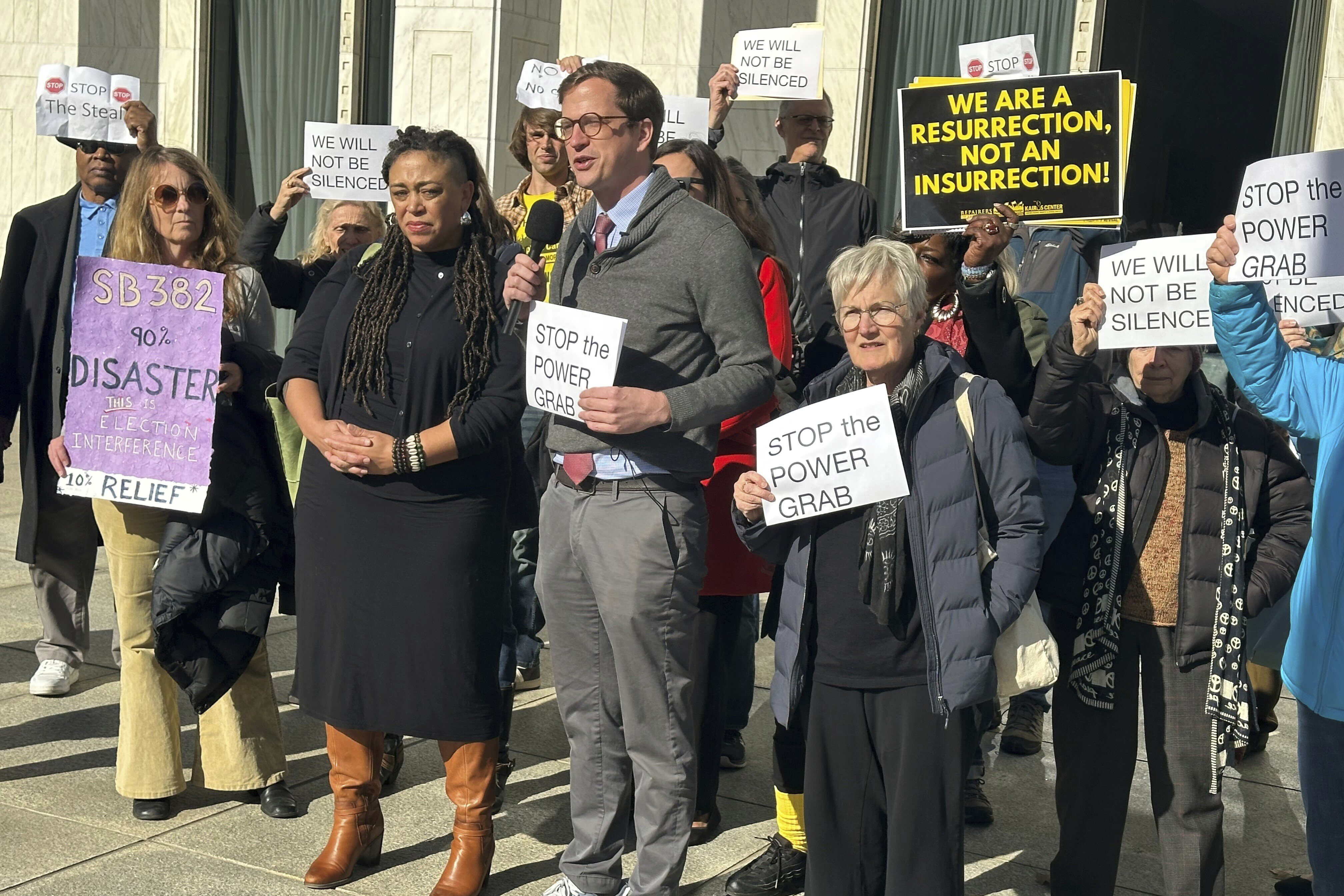 The Rev. Rob Stephens with the NC Poor People's Campaign speaks at a news conference outside the North Carolina Legislative Building in Raleigh, N.C. on Monday, Dec. 2, 2024. (AP Photo/Gary D. Robertson)