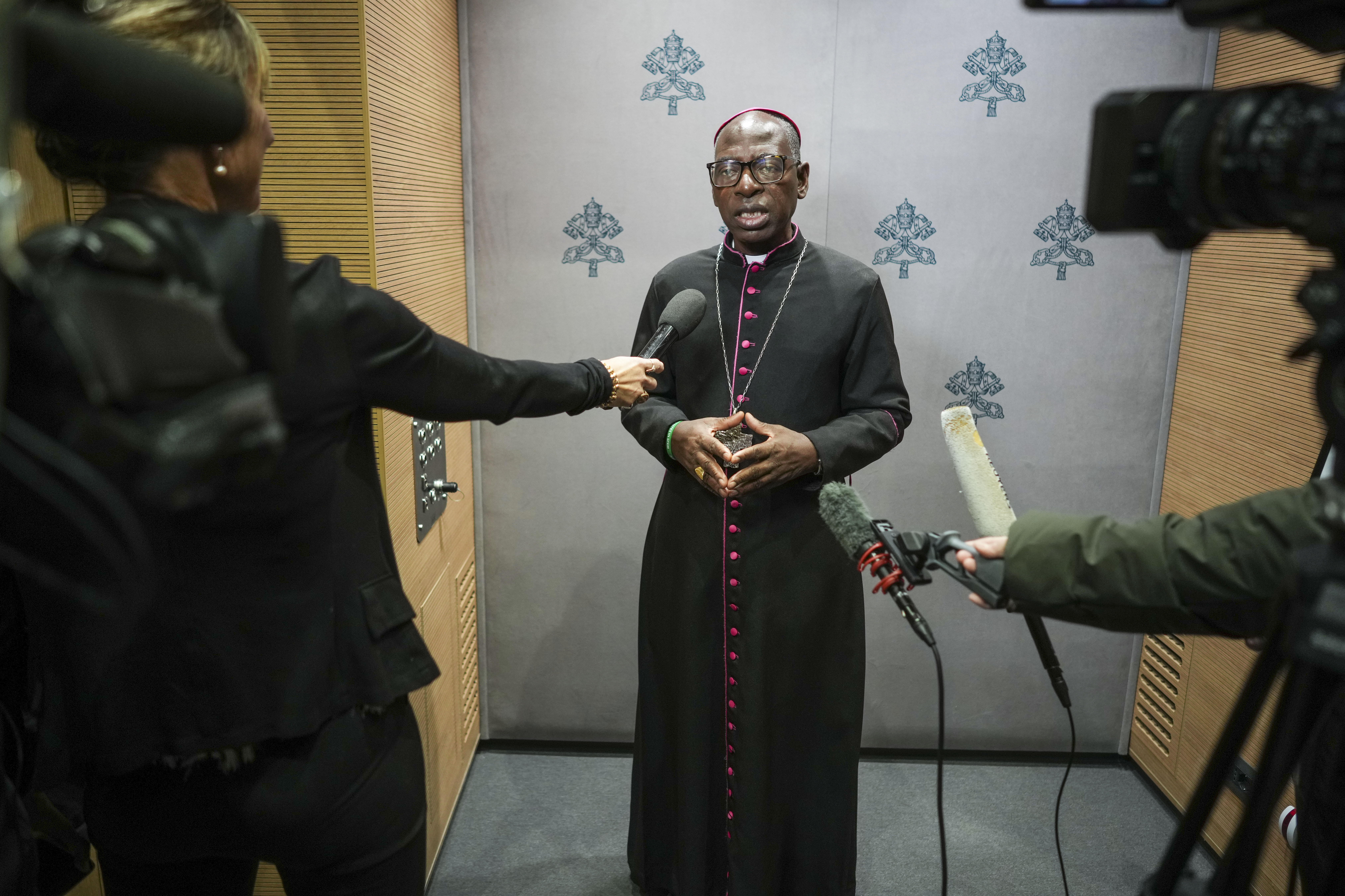 Newly appointed cardinal Ignace Bessi Dogbo archbishop of Abidjan, Ivory Coast meets journalists in the Vatican press room ahead of his elevation, Friday, Dec. 6, 2024. (AP Photo/Andrew Medichini)