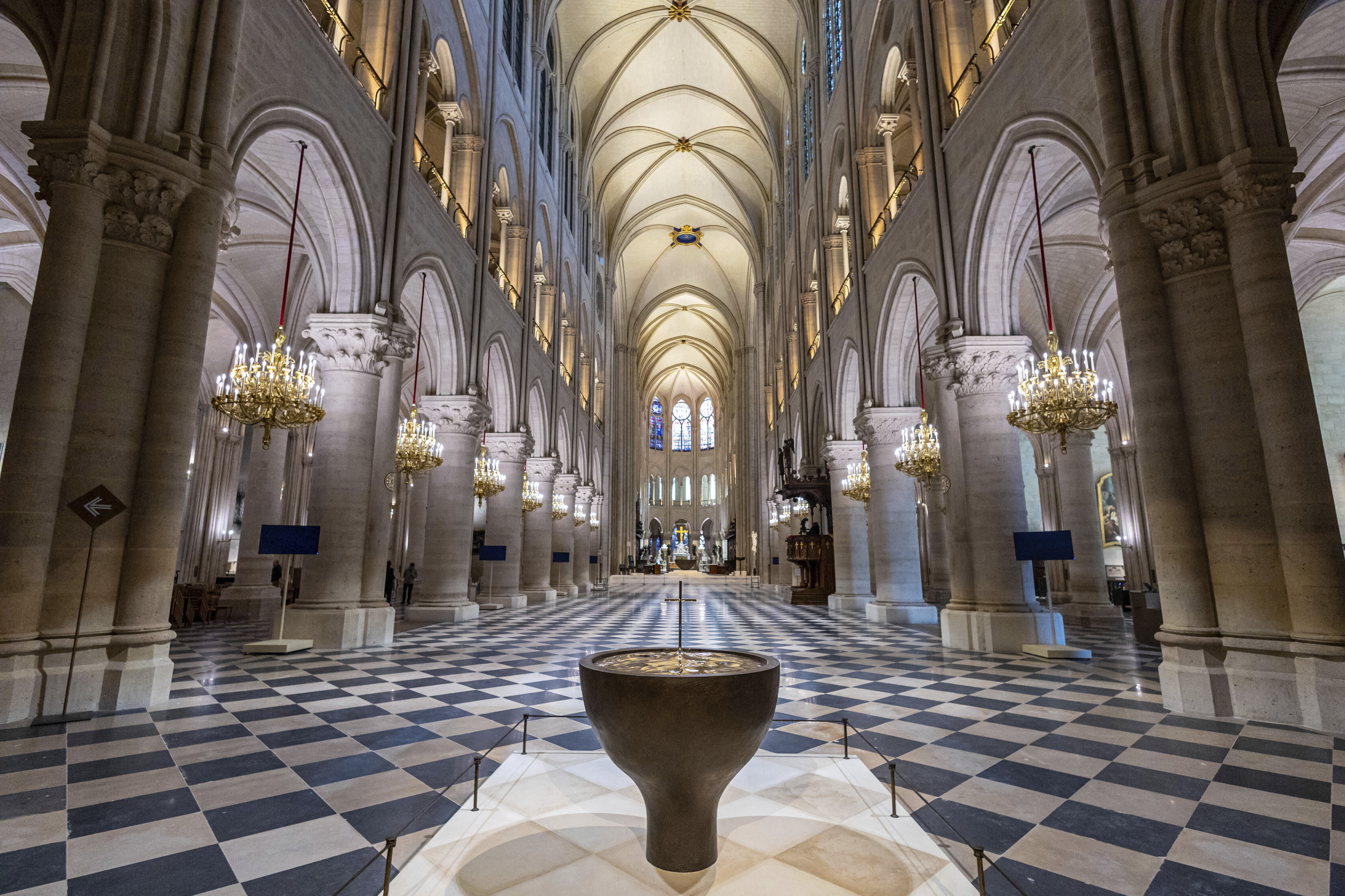 FILE - The baptistery designed by French artist and designer Guillaume Bardet is pictured as French President Emmanuel Macron visits the restored interiors of the Notre-Dame de Paris cathedral, Friday, Nov. 29, 2024 in Paris. (Christophe Petit Tesson/Pool via AP, File)