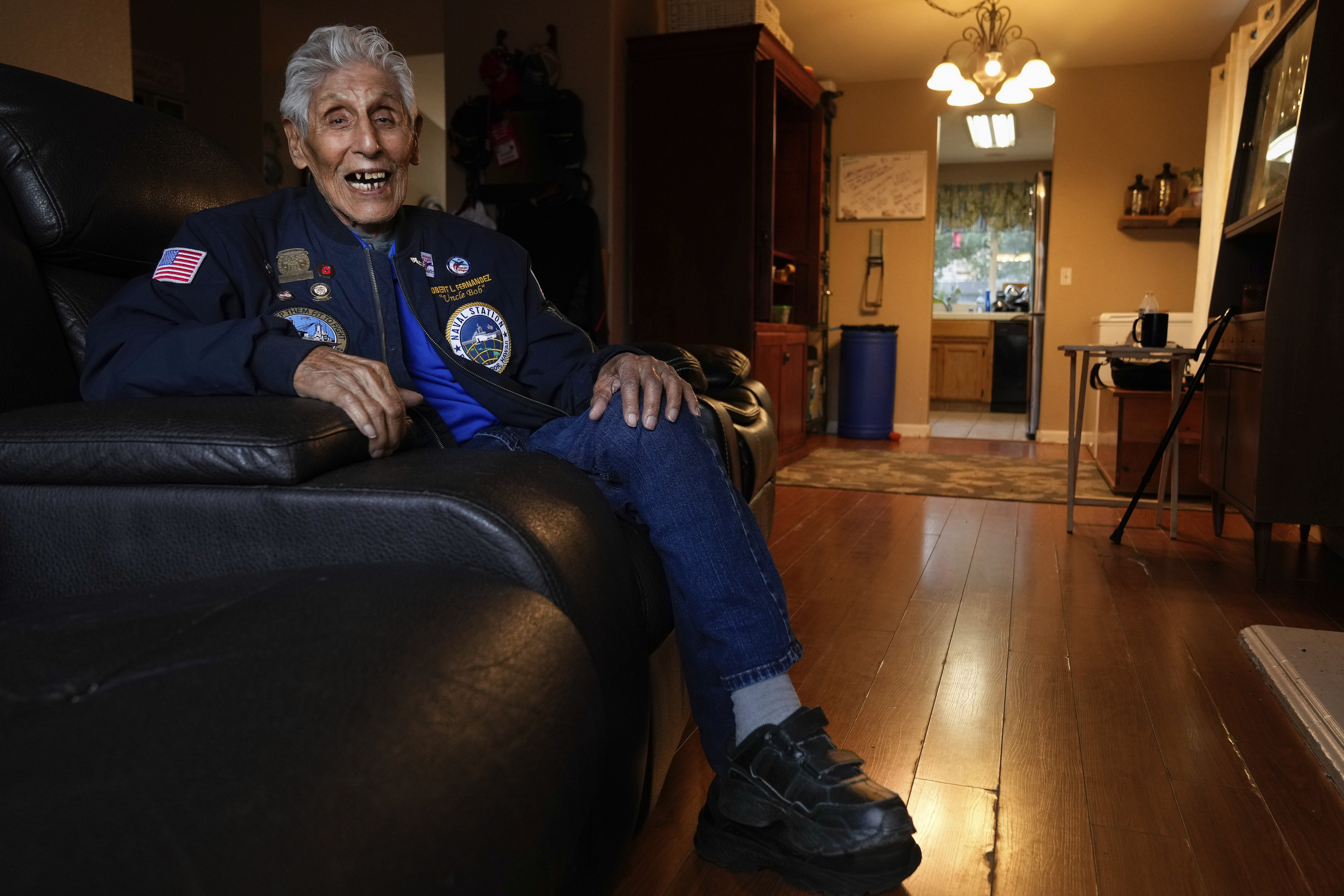 Pearl Harbor Navy veteran Bob Fernandez smiles while being photographed at home Tuesday, Nov. 19, 2024, in Lodi, Calif. (AP Photo/Godofredo A. Vásquez)