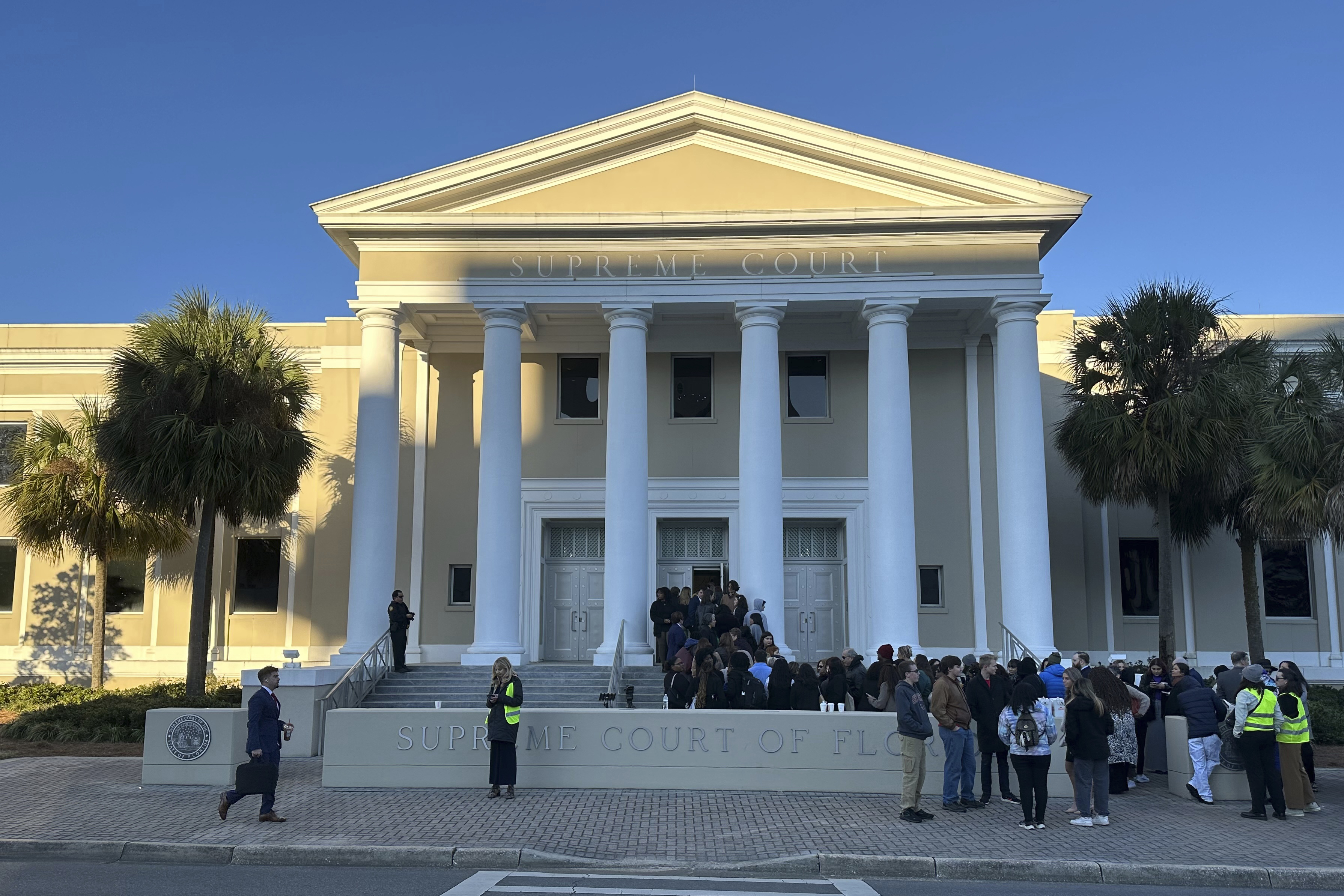 FILE - People gather outside the Florida Supreme Court, Feb. 7, 2024, in Tallahassee, Fla. (AP Photo/Brendan Farrington, File)