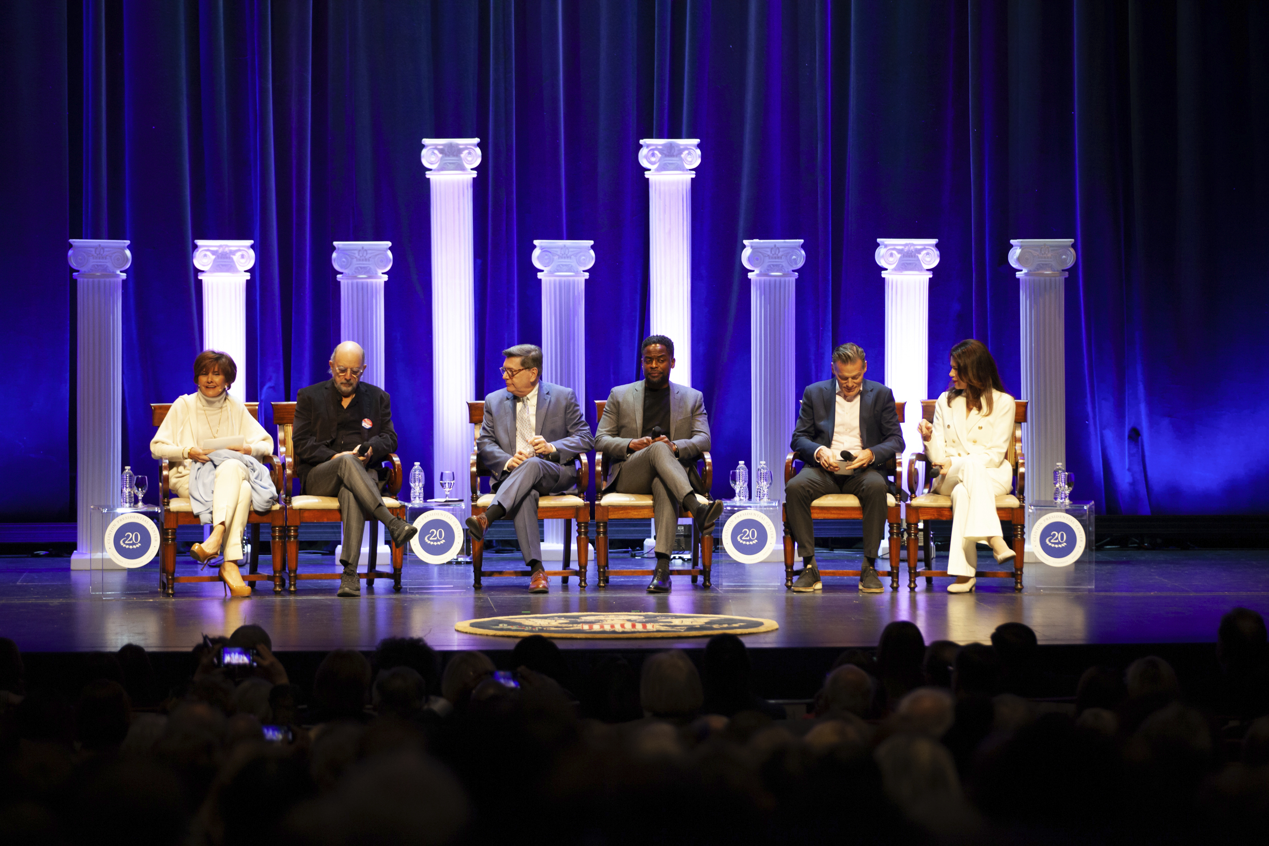 A panel of cast members from The West Wing alongside former White House staff members reflect on acts of service during the Kumpuris Distinguished Lecture series at the Robinson Center in Little Rock, Ark., on Saturday, Dec. 7, 2024. (AP Photo/Katie Adkins)