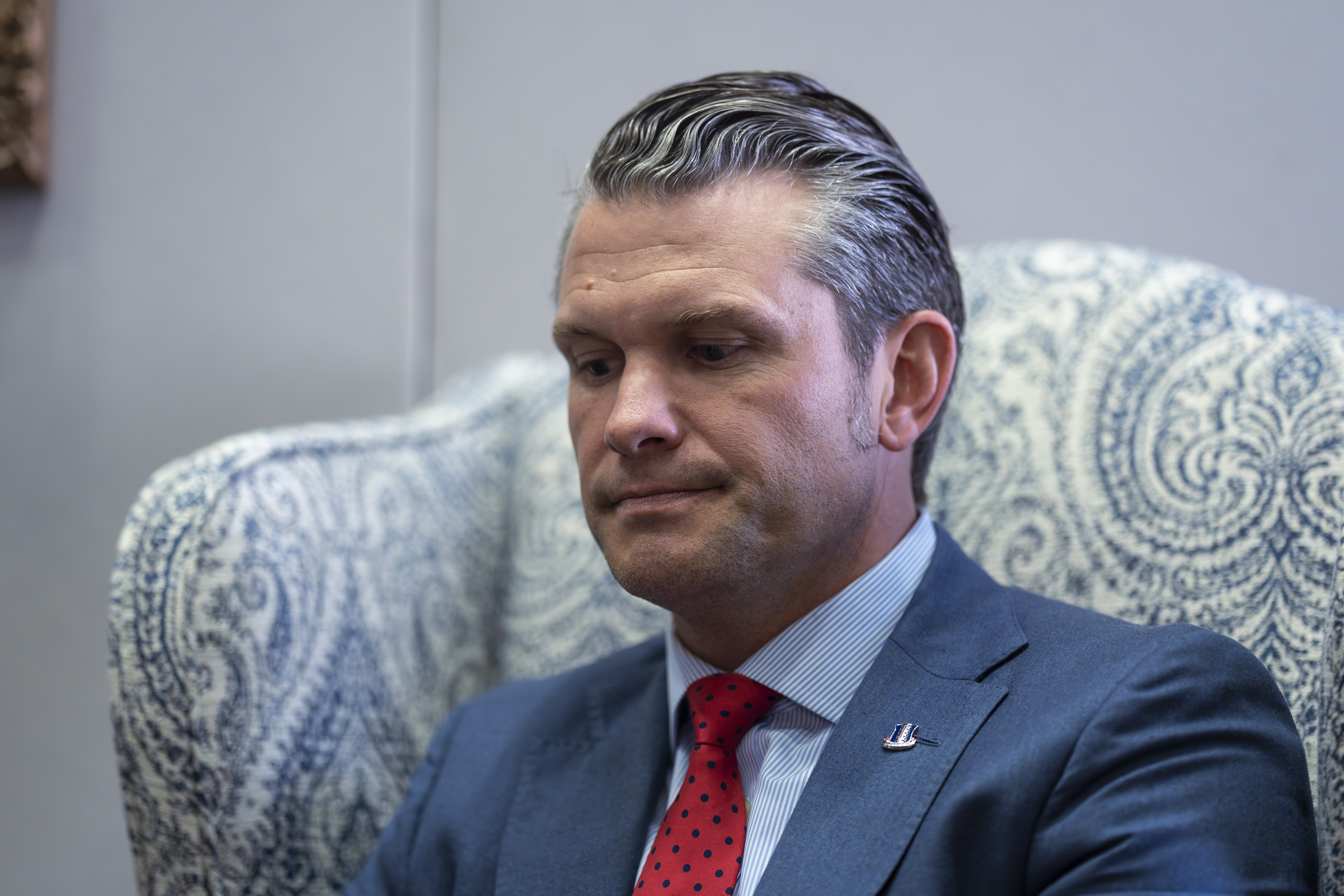 Pete Hegseth, President-elect Donald Trump's nominee to be defense secretary, listens to reporters during a meeting with Sen. Mike Rounds, R-S.D., a member of the Senate Armed Services Committee, at the Capitol in Washington, Thursday, Dec. 5, 2024. (AP Photo/J. Scott Applewhite)