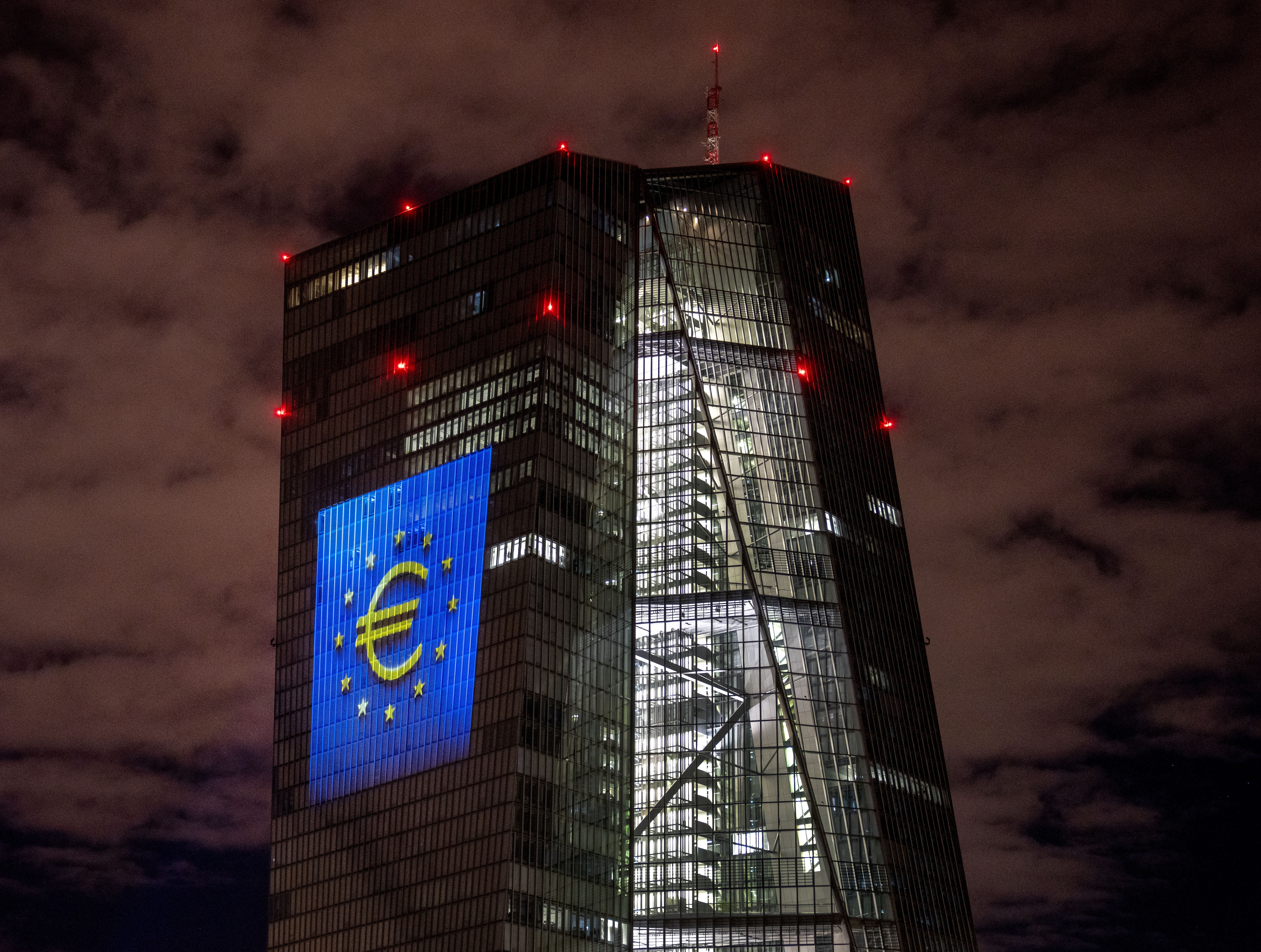 FILE - A light installation is projected onto the building of the European Central Bank during a rehearsal in Frankfurt, Germany, Thursday, Dec. 30, 2021. (Photo/Michael Probst, File)