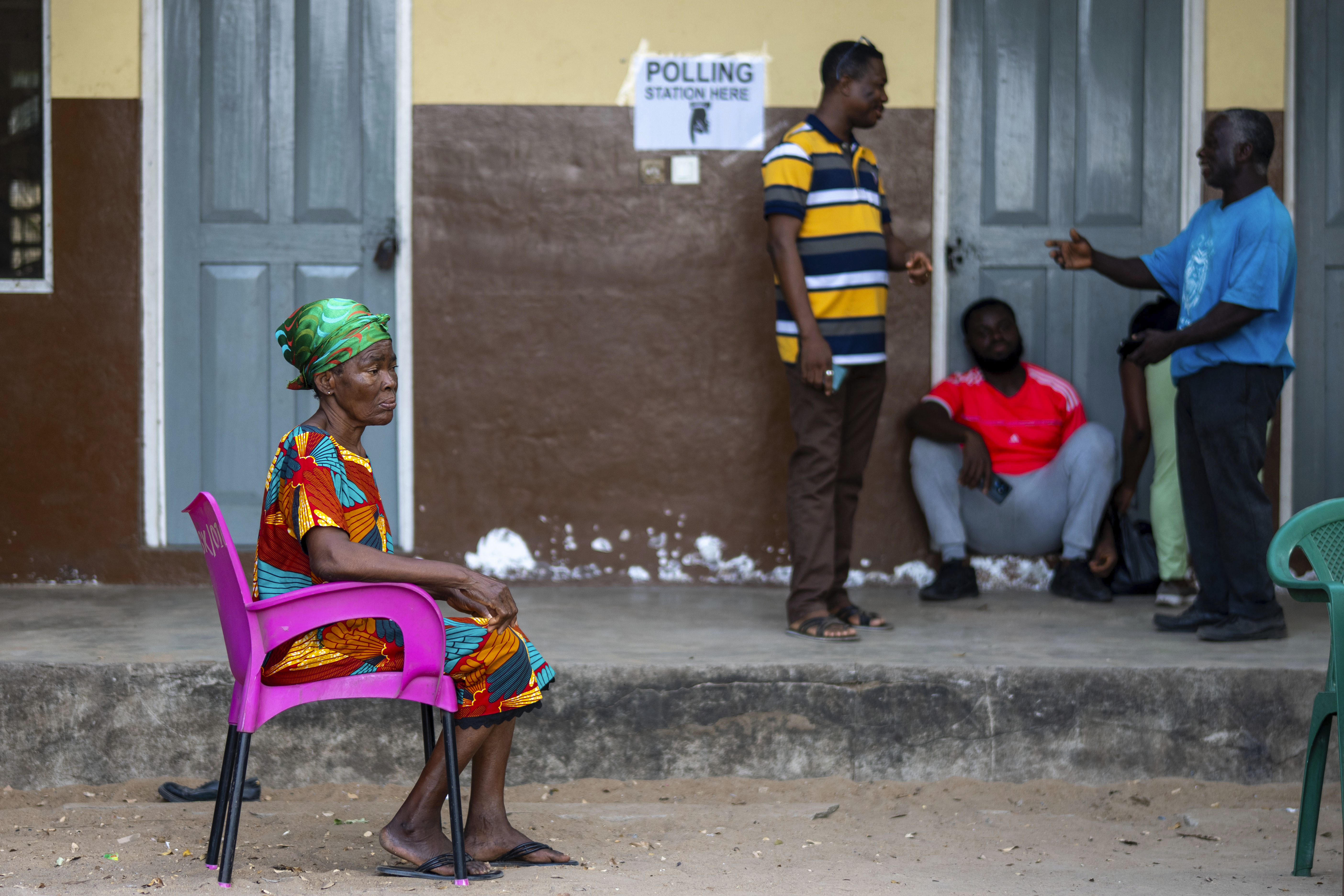 Electoral commission volunteers wait for the opening of the polling stations for the general elections in Accra, Ghana, Saturday, Dec. 7, 2024 (AP Photo/Jerome Delay)