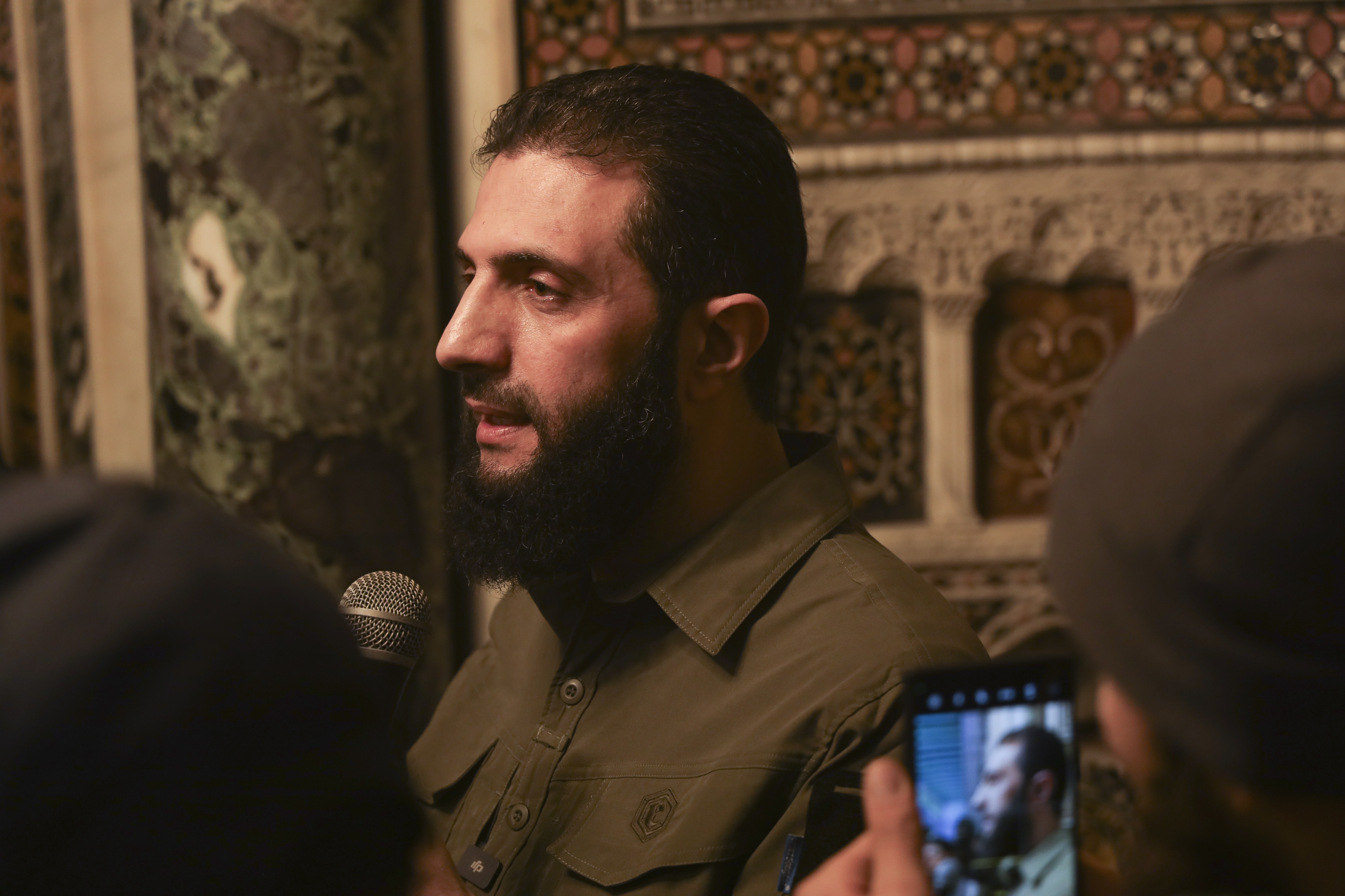 Abu Mohammed al-Golani speaks at the Umayyad Mosque in Damascus Sunday Dec. 8, 2024. Golani, a former al-Qaida commander who cut ties with the group and says he embraces pluralism and religious tolerance, leads the biggest rebel faction and is poised to chart the country's future. He calls himself by his given name, Ahmad al-Sharaa, and not his nom de guerre.(AP Photo/Omar Albam)