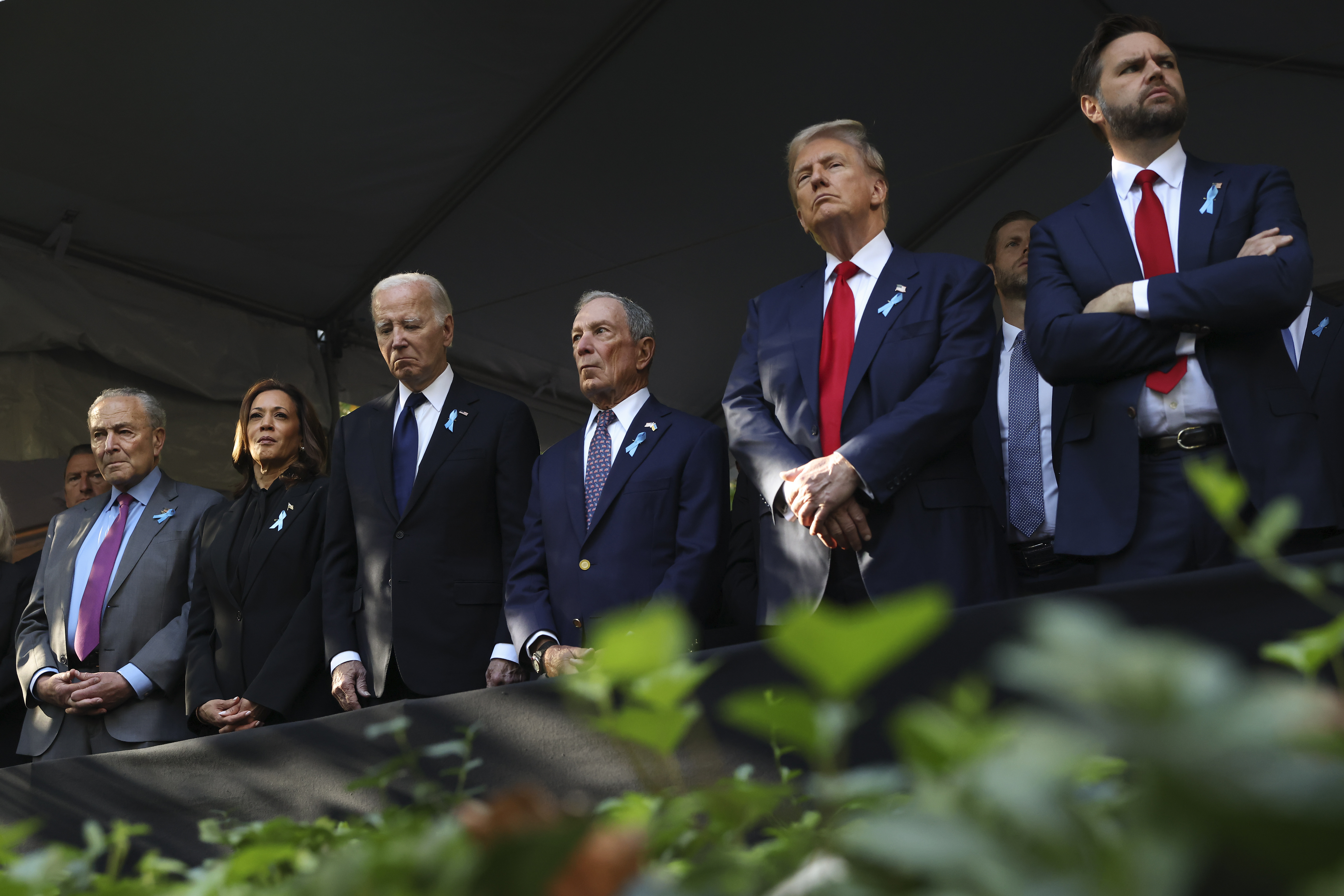 FILE - From left, Sen. Chuck Schumer, D-NY, Democratic presidential nominee Vice President Kamala Harris, President Joe Biden, Michael Bloomberg, Republican presidential nominee former President Donald Trump and Republican vice presidential nominee Sen. JD Vance, R-Ohio, attend the 9/11 Memorial ceremony on the 23rd anniversary of the Sept. 11, 2001 attacks, on Sept. 11, 2024, in New York. (AP Photo/Yuki Iwamura, File)