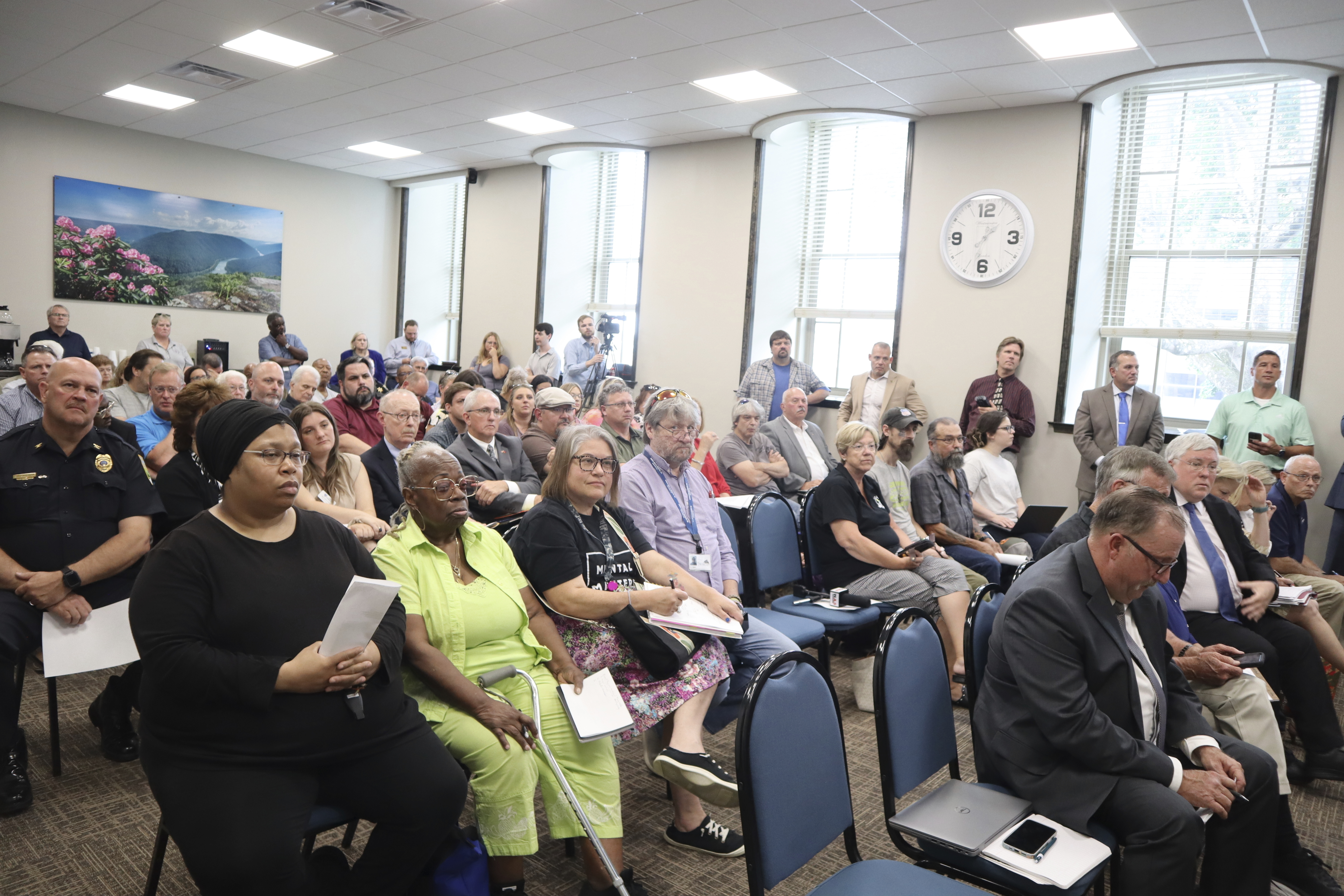 FILE - Local representatives and recovery advocates gather at the Raleigh County Courthouse in Beckley, W.Va. to select the southern West Virginia representative for the West Virginia First Foundation Board of Directors that will be responsible for distributing the lion's share of the over $1 billion collected by the state in opioid settlement money, on July 5, 2023. (AP Photo/Leah Willingham, File)