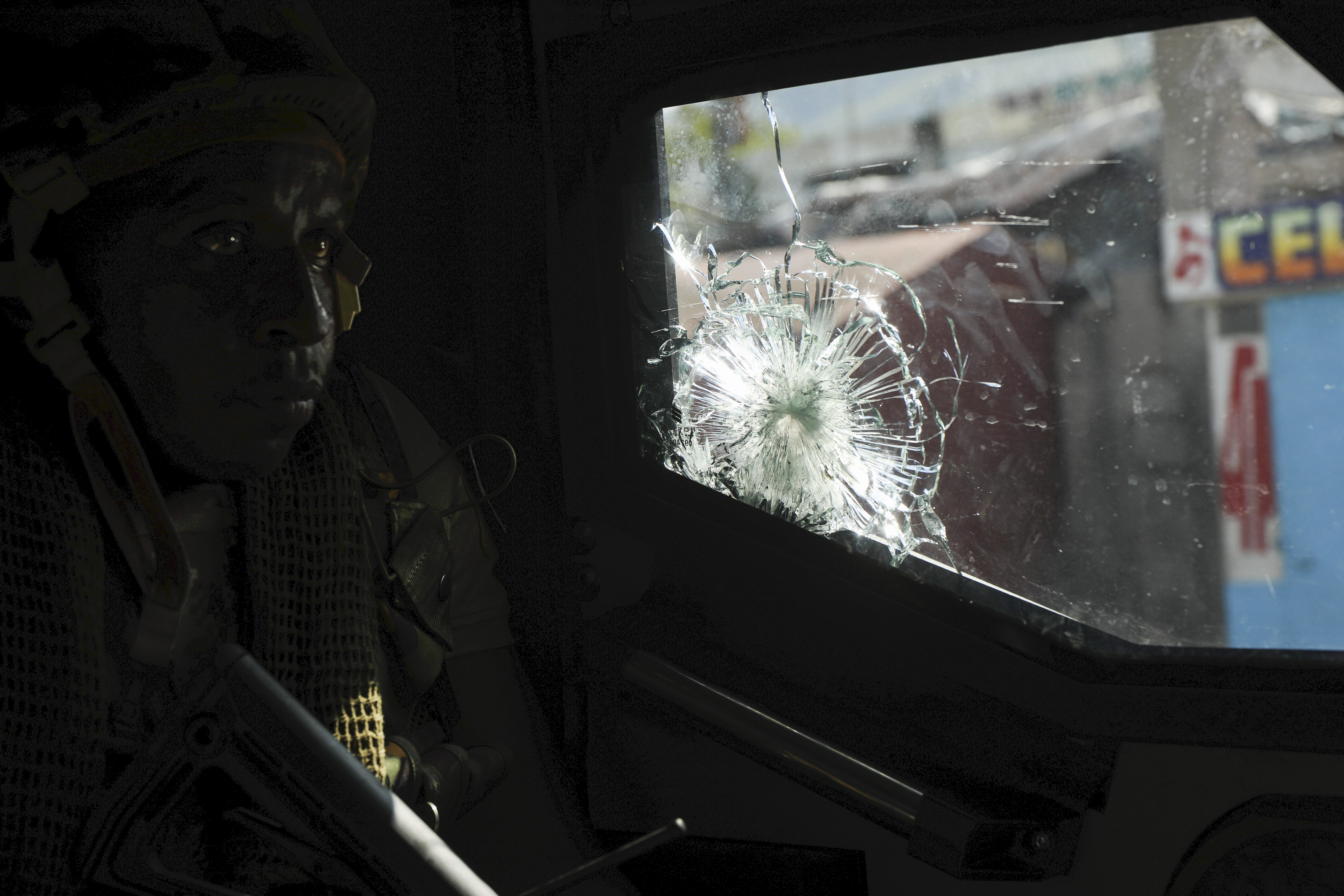 A Kenyan police officer, part of a UN-backed multinational force, patrols a street in Port-au-Prince, Haiti, Thursday, Dec. 5, 2024. (AP Photo/Odelyn Joseph)