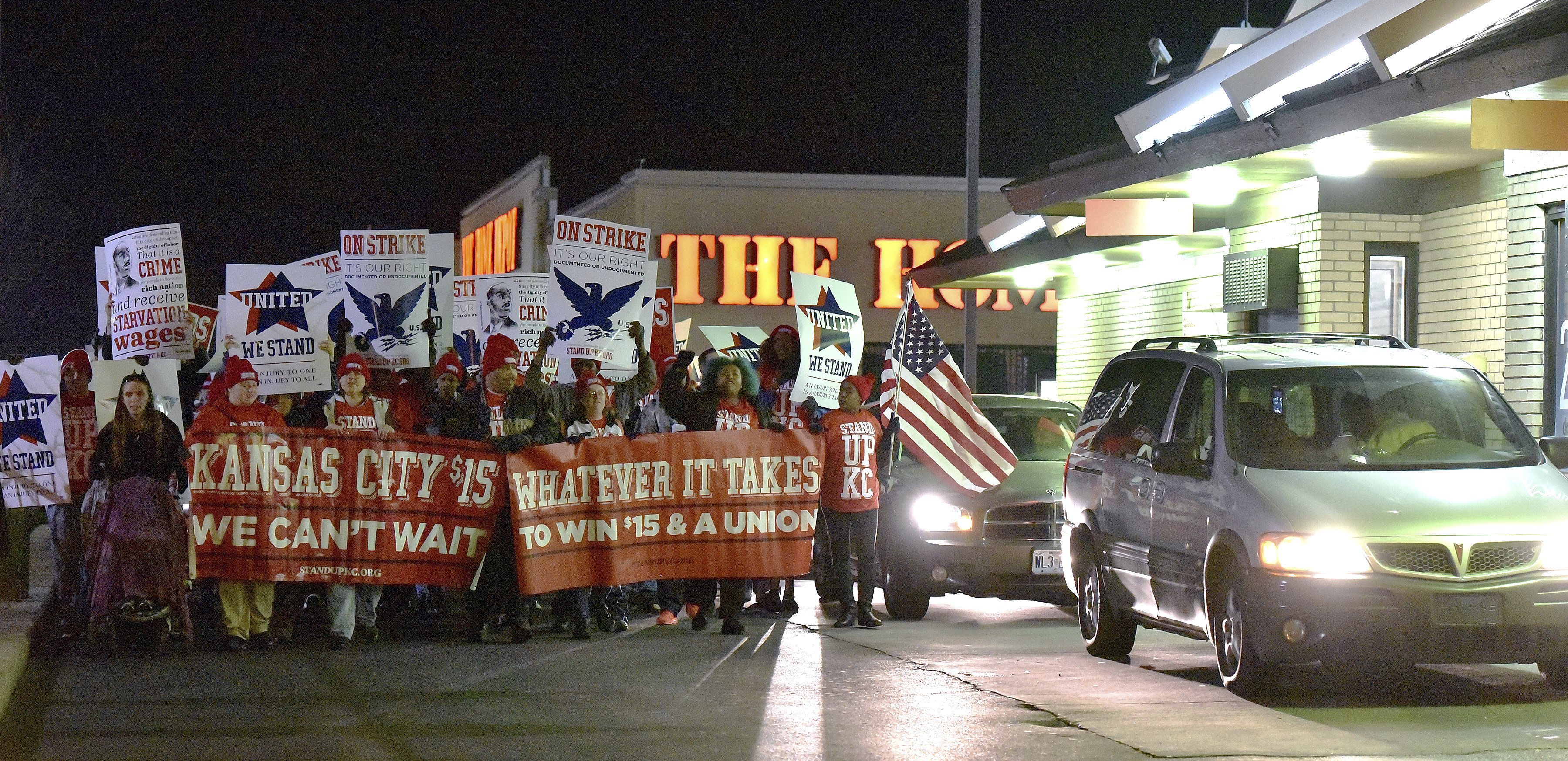 FILE - Protesters march around a McDonald's restaurant, Nov. 29, 2016, in Kansas City, Mo., as part of a national day of protest organized by Fight for $15 and United We Stand movements, seeking higher hourly wages, including for workers at fast-food restaurants and airports. (John Sleezer/The Kansas City Star via AP, file)