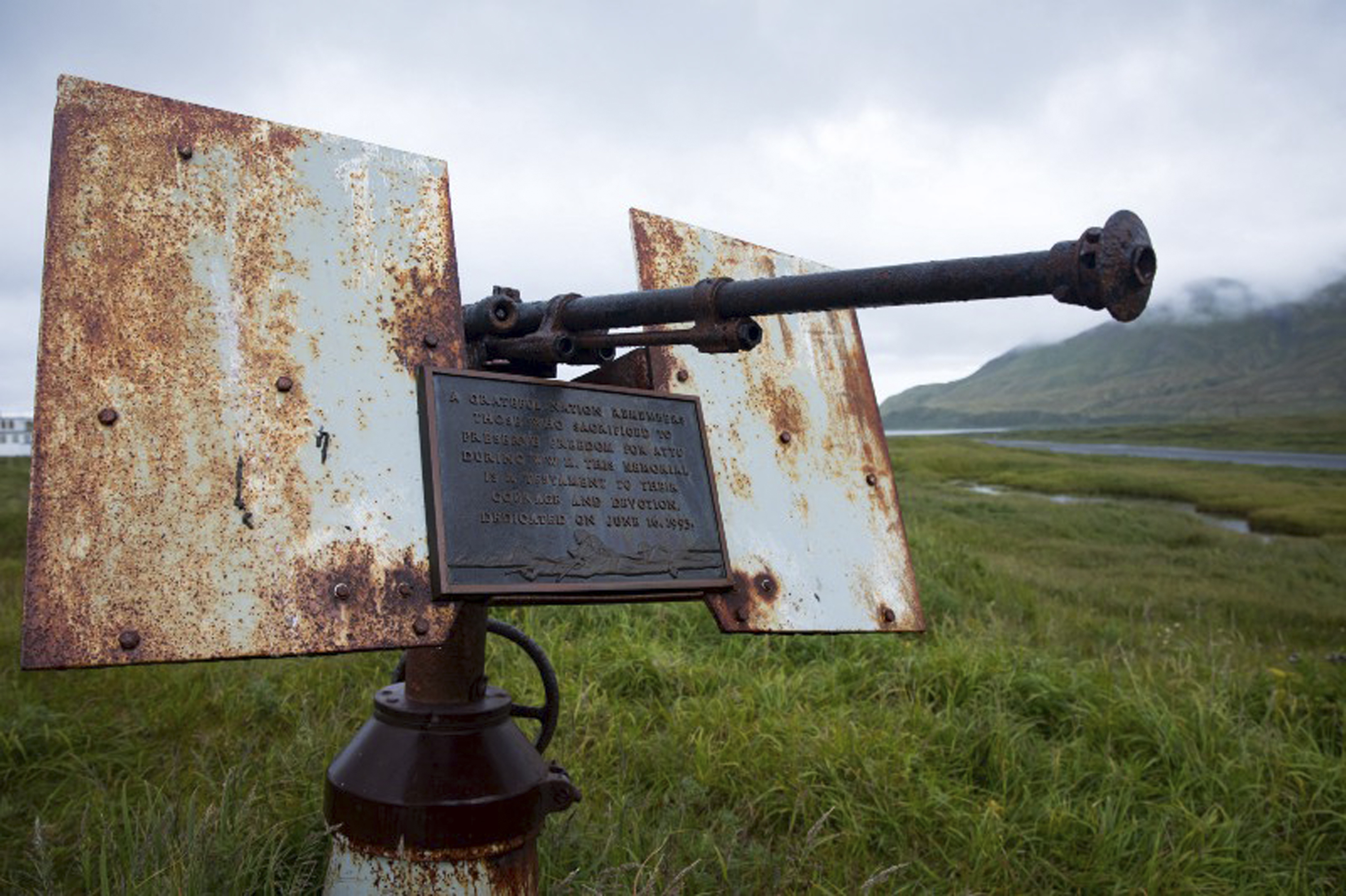 FILE - In this photo provided by the U.S. Fish and Wildlife Service, an artillery monument sits above Massacre Bay on Attu Island, Alaska, on Aug. 22, 2017. (Lisa Hupp/U.S. Fish and Wildlife Service via AP, File)