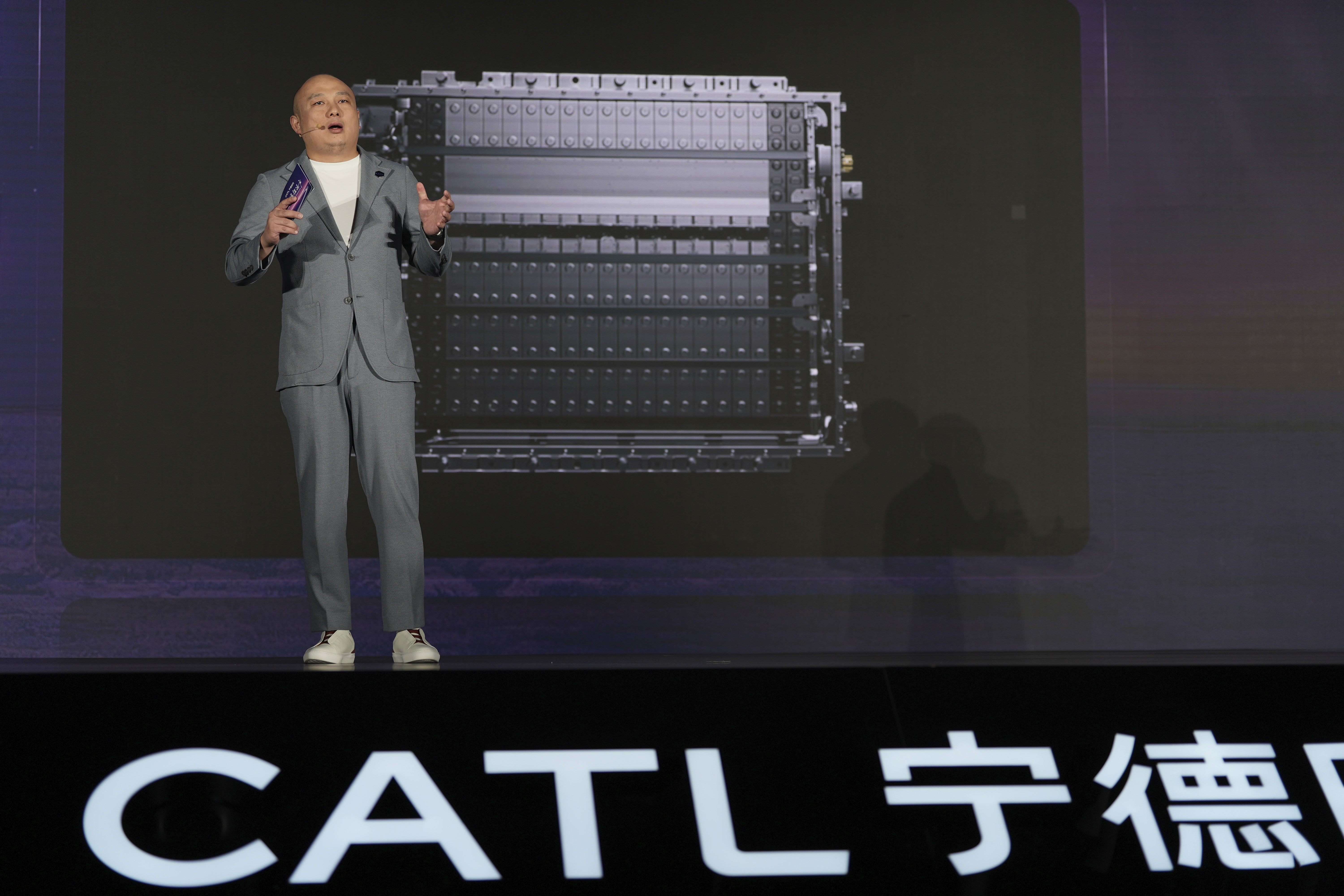 FILE - Gao Huan, CTO of CATL's China E-car Business, introduces the latest Freevoy Super Hybrid Battery from Chinese battery manufacturer Contemporary Amperex Technology (CATL) during a launch event in Beijing, Thursday, Oct. 24, 2024. (AP Photo/Ng Han Guan, File)