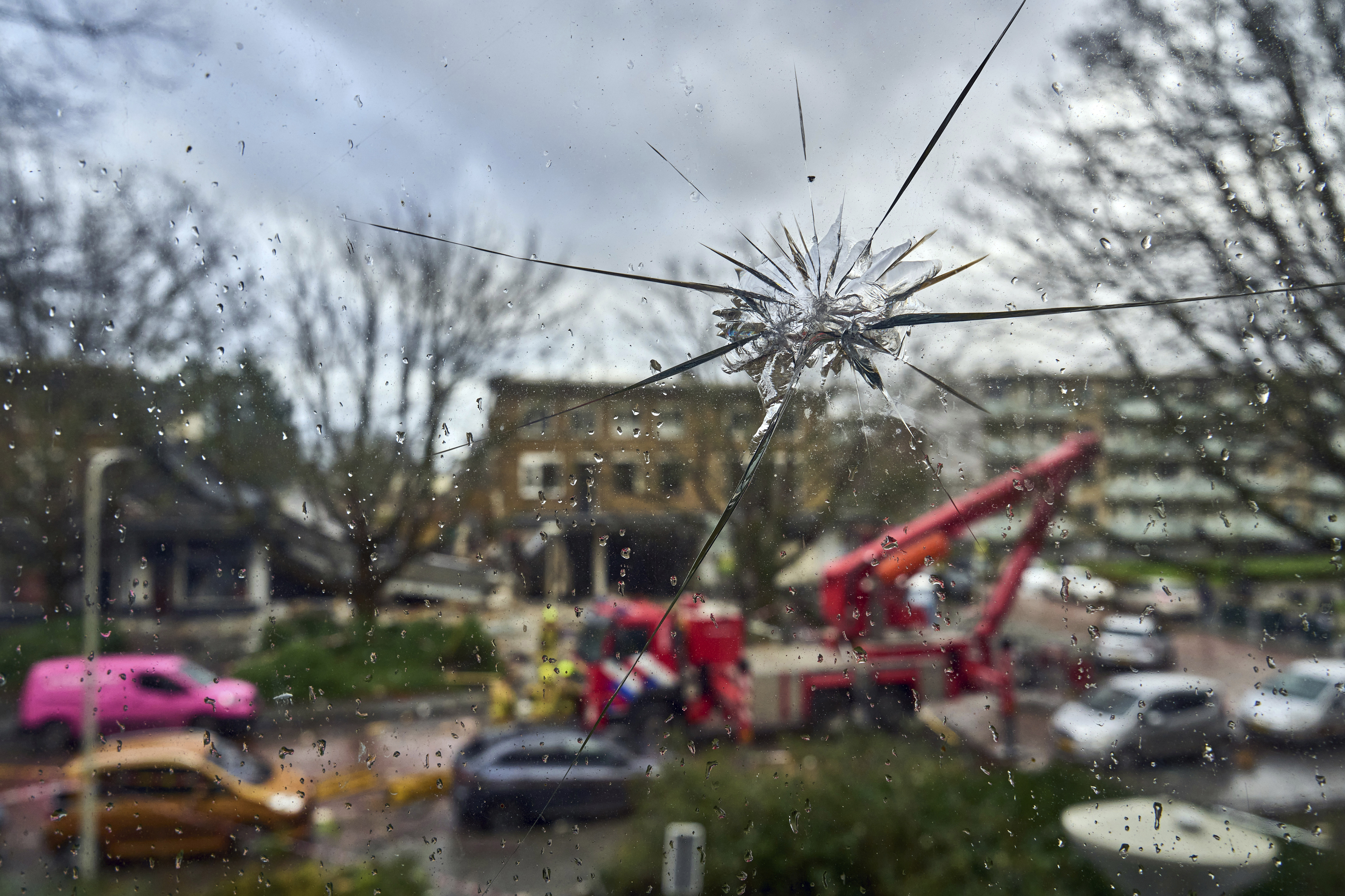 A window of a flat across the street of the site of an explosion, which destroyed several apartments and injured multiple people, is seen damaged as the view overlooks the exploded area, at The Hague, Saturday, Dec. 7, 2024. (AP Photo/Phil Nijhuis)