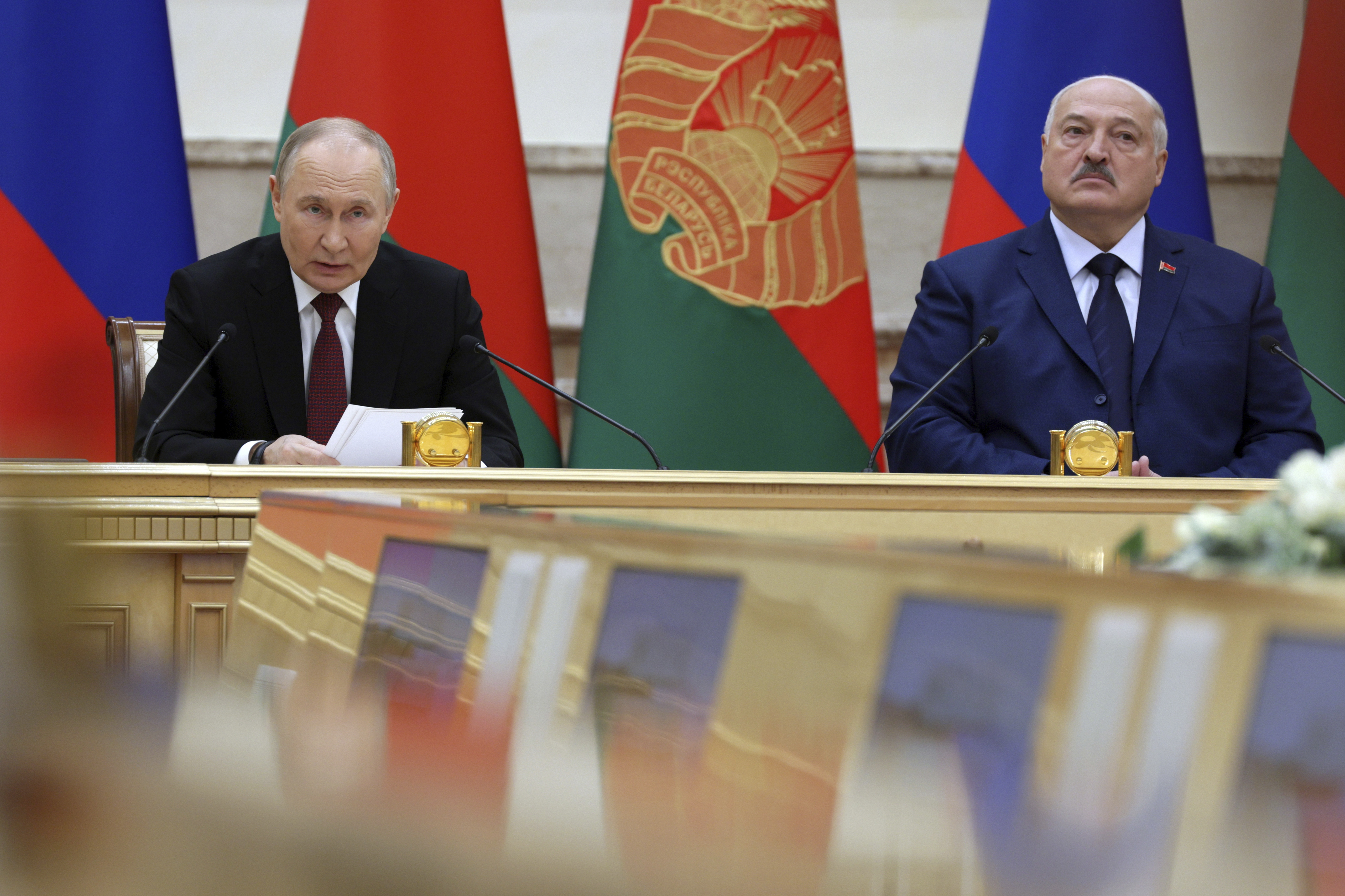 Russian President Vladimir Putin and Belarusian President Alexander Lukashenko attend a signing ceremony following a meeting of the Supreme State Council of the Russia-Belarus Union State marking the 25th anniversary of the Union State Treaty in Minsk, Belarus, Friday, Dec. 6, 2024. (Gavriil Grigorov, Sputnik, Kremlin Pool Photo via AP)