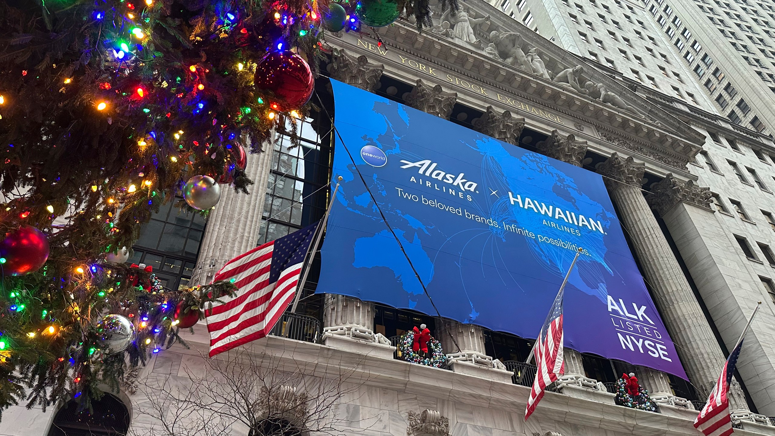 A banner for Alaska Air Group hangs on the front of the New York Stock Exchange in New York's Financial District on Tuesday, Dec. 10, 2024. (AP Photo/Peter Morgan, File)