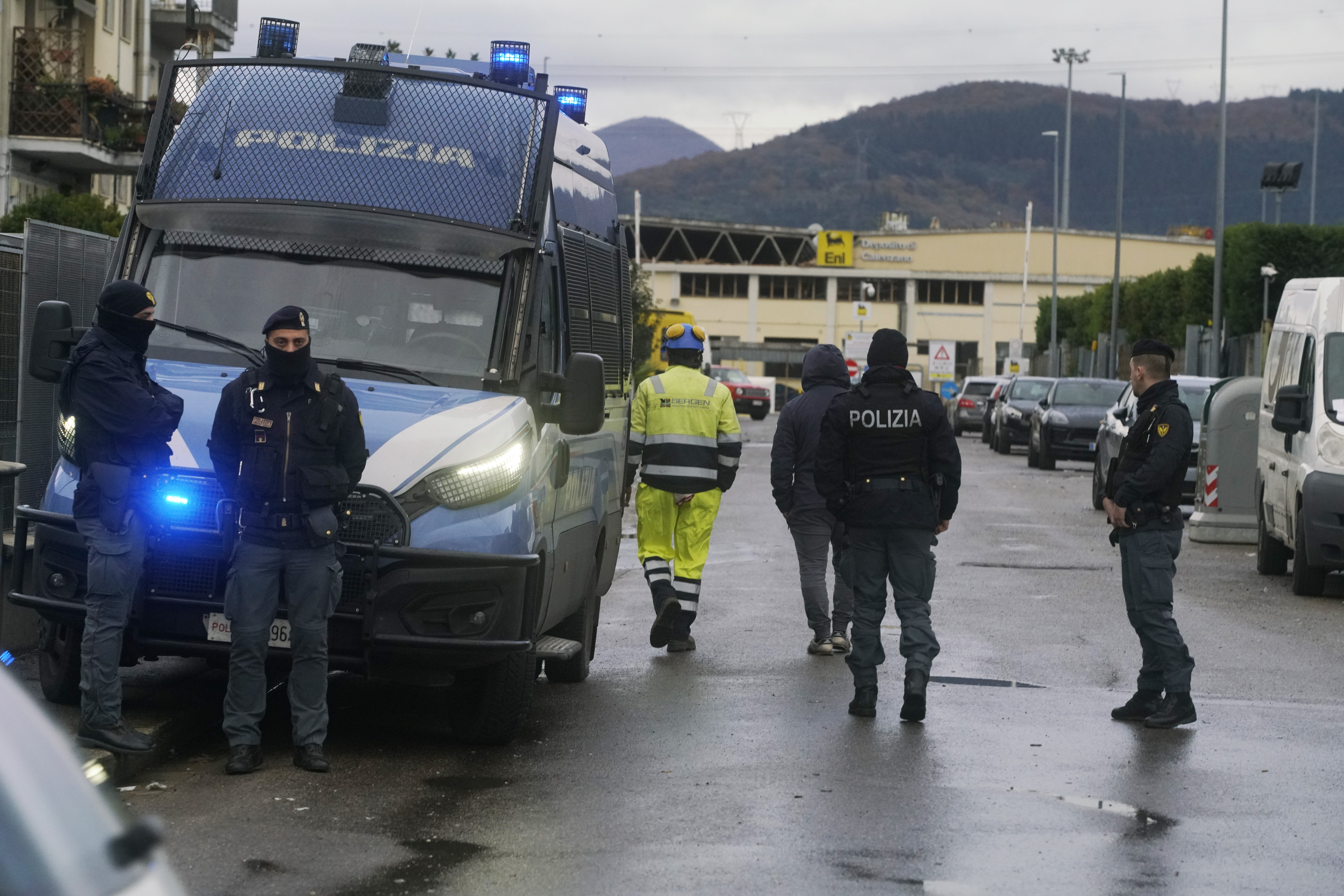 Police work on a site of a fuel depot's explosion in Calenzano, near Florence, Italy, Monday, Dec. 9, 2024. (Alessandro La Rocca/LaPresse via AP)