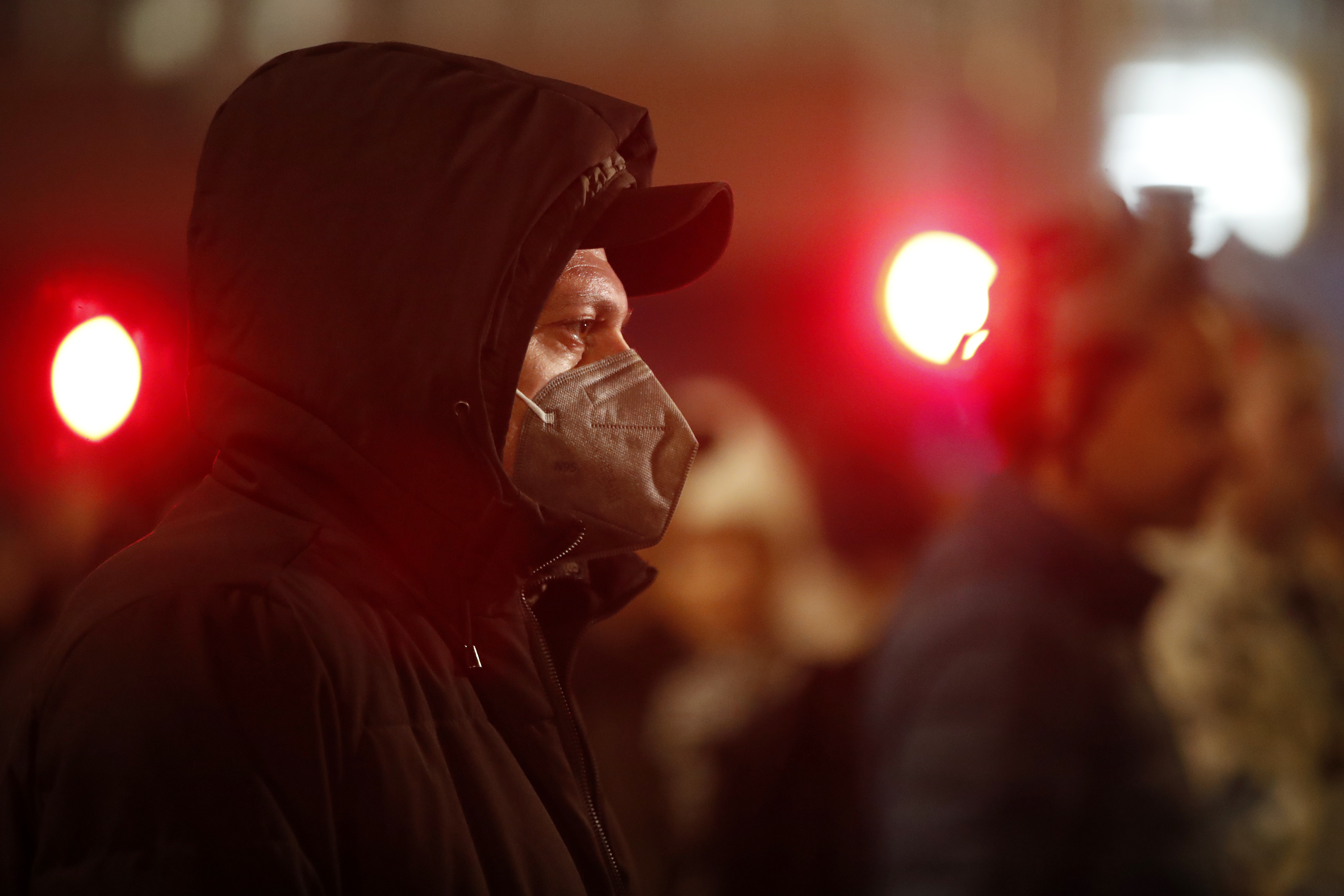 A man with a face mask attends a protest organized by the Green Humane City initiative, demanding effective measures in combating the air pollution in Skopje, North Macedonia, on Tuesday, Dec. 10, 2024. (AP Photo/Boris Grdanoski)