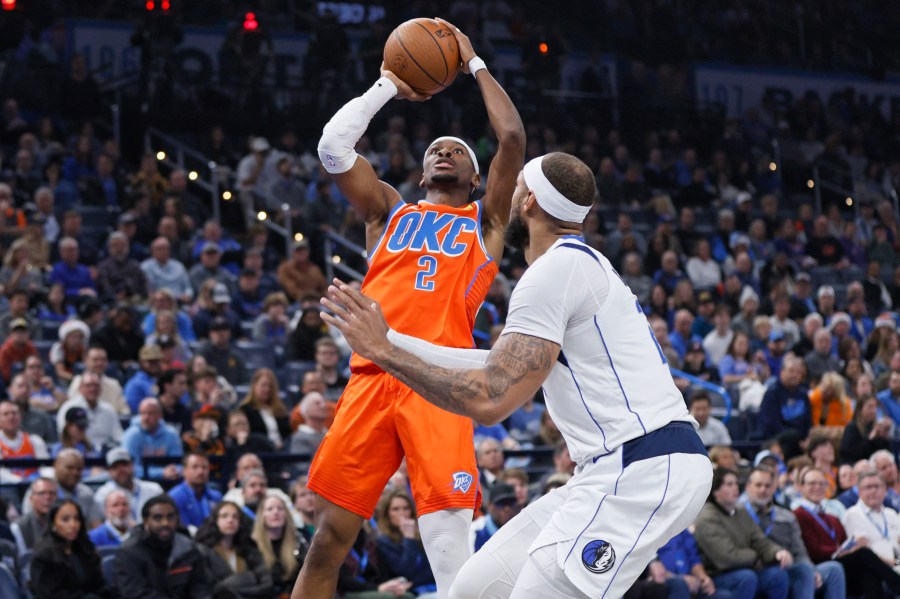 Oklahoma City Thunder guard Shai Gilgeous-Alexander (2) shoots against Dallas Mavericks center Daniel Gafford, right, during the first half of an Emirates NBA Cup basketball game, Tuesday, Dec. 10, 2024, in Oklahoma City. (AP Photo/Nate Billings)