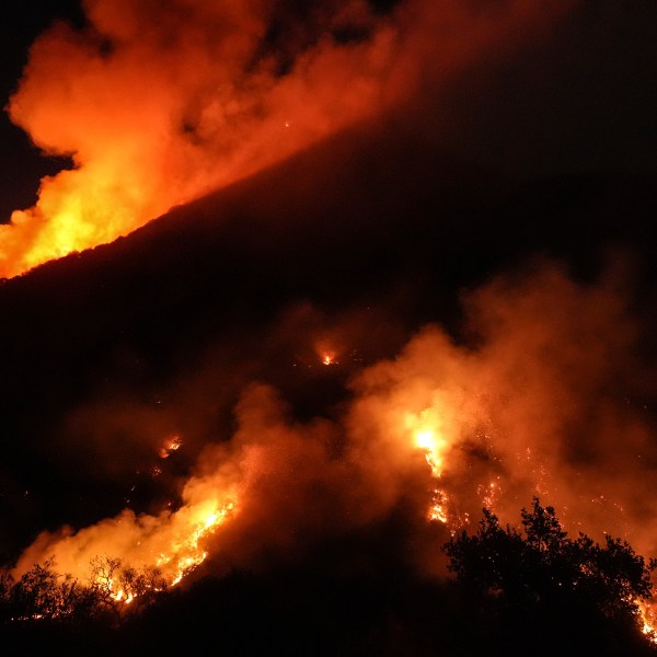 Flames erupt on a mountain as the Franklin Fire burns in Malibu, Calif., Tuesday, Dec. 10, 2024. (AP Photo/Jae C. Hong)